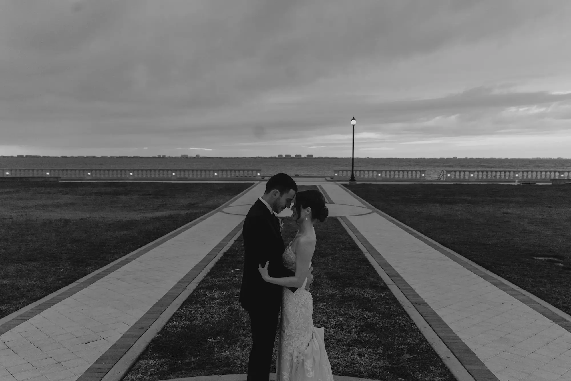 Black and White Bride and Groom Waterfront Wedding Portrait | Tampa Bay Photographer We The Blackwells | Historic Academic Venue The New College of Florida