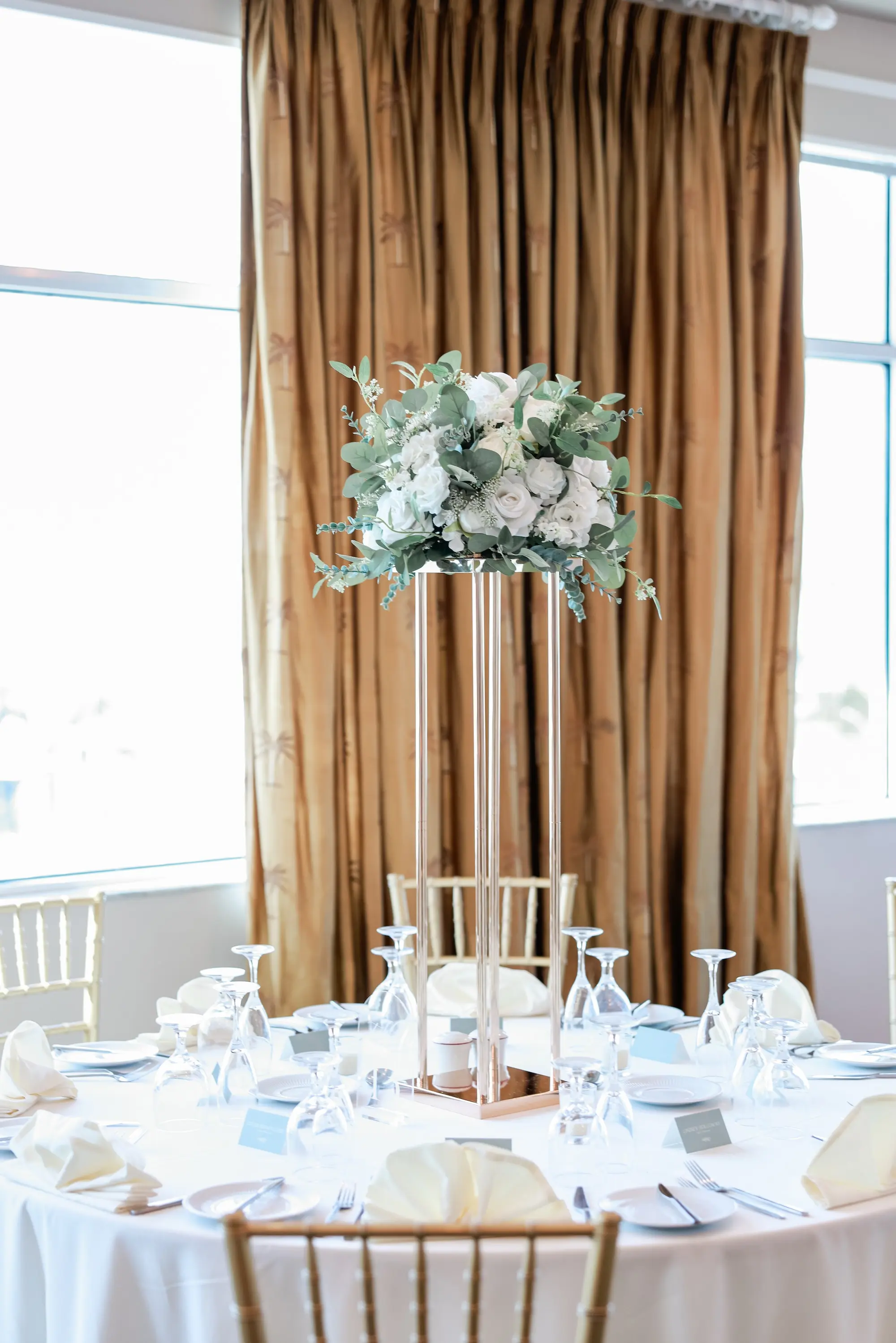 Luxurious Ballroom Wedding Reception | White Linens and Tall Acrylic Centerpieces with White Roses, and Greenery Flower Arrangement Ideas | St Pete Event Venue Isla Del Sol Yacht and Country Club | Tampa Bay Planner Planner Coastal Coordinating
