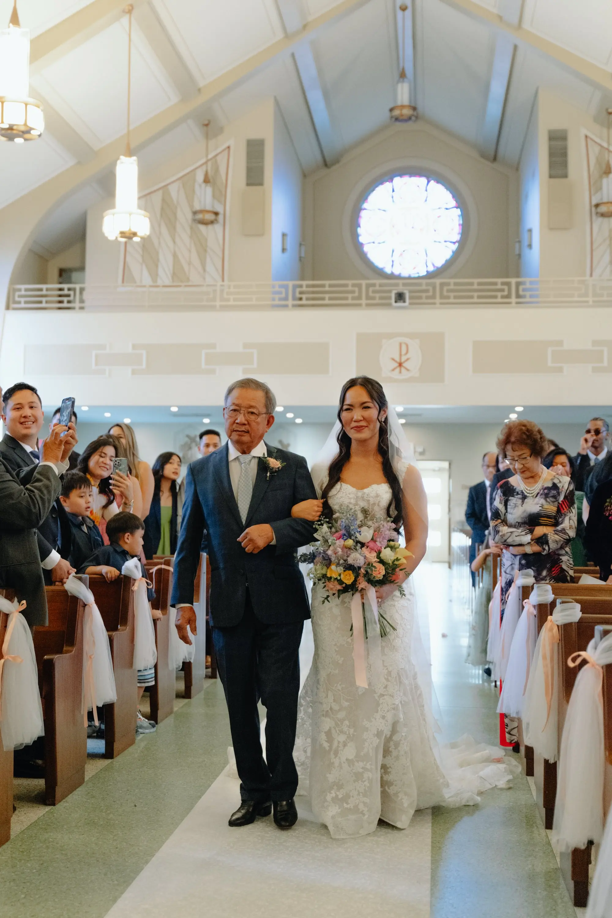 Bride and Father Walking Down Wedding Aisle