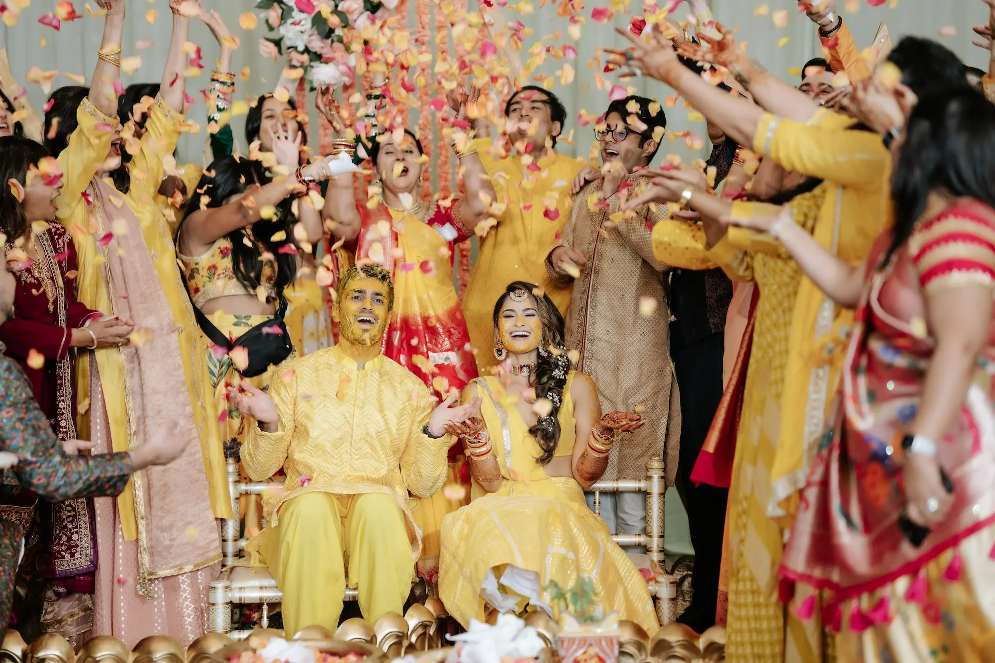 Bride and Groom Haldi Wedding Ceremony Inspiration | Yellow, Pink and Red Rose Petals Indian Wedding Decor Ideas | Traditional Indian Wedding Clothing Yellow Lehenga Choli and Kurta Pajama Set Inspiration