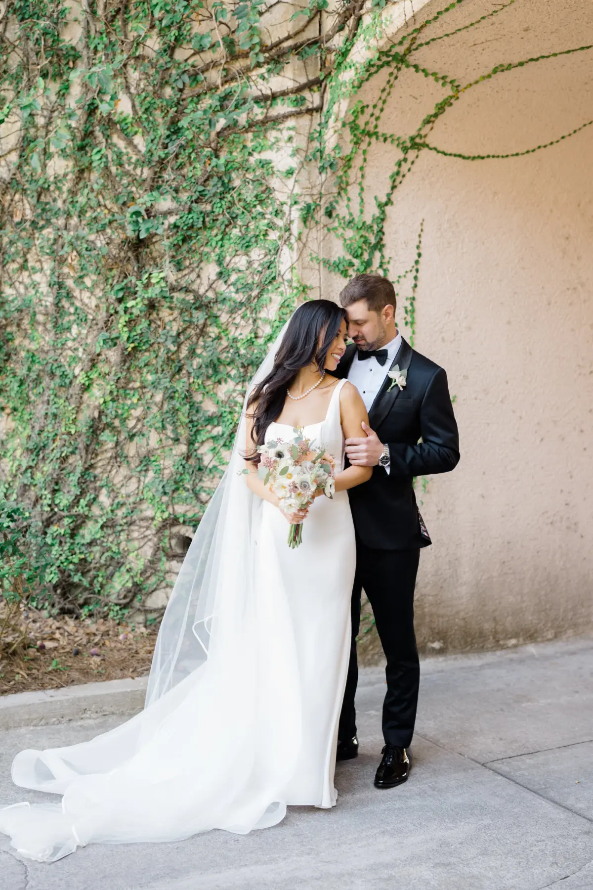 13Romantic Pastel and Navy Sarasota Wedding Inspiration - “Best Of” 2025: Wedding Portraits Bride and Groom Outdoor Wedding Portrait | Elegant A-Line Paloma Blanca Wedding Gown with Square Neckline and Traditional Chapel Length Tulle Veil Inspiration | Lush White and Blush Floral Arrangement Ideas | Susan Elizabeth Weddings Tampa Wedding Photographer