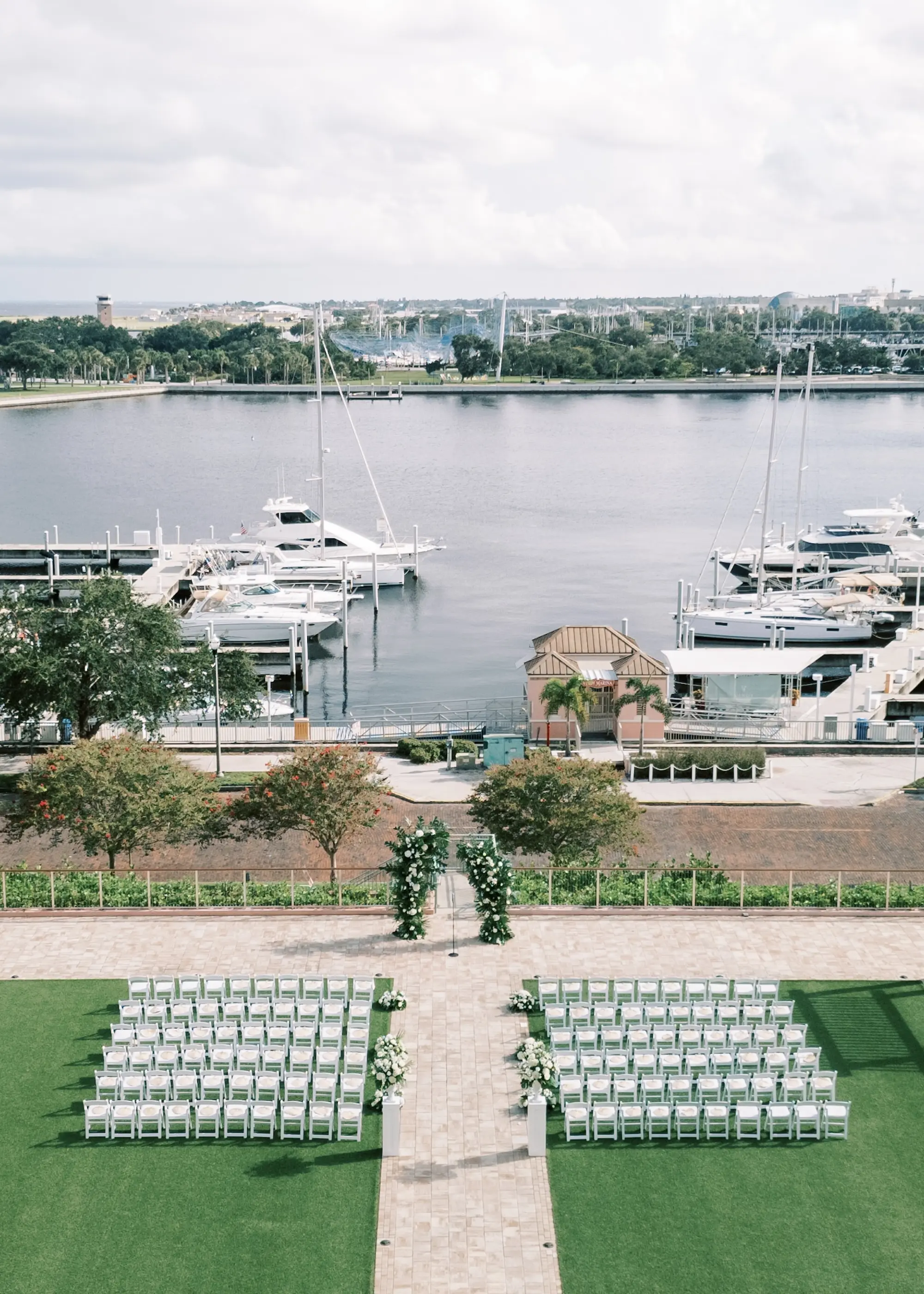 White and Green Elegant Tropical Terrace Wedding Ceremony Arch Inspiration | St Pete Event Venue The Vinoy | Tampa Bay Kate Ryan Event Rentals | Florist Lemon Drops