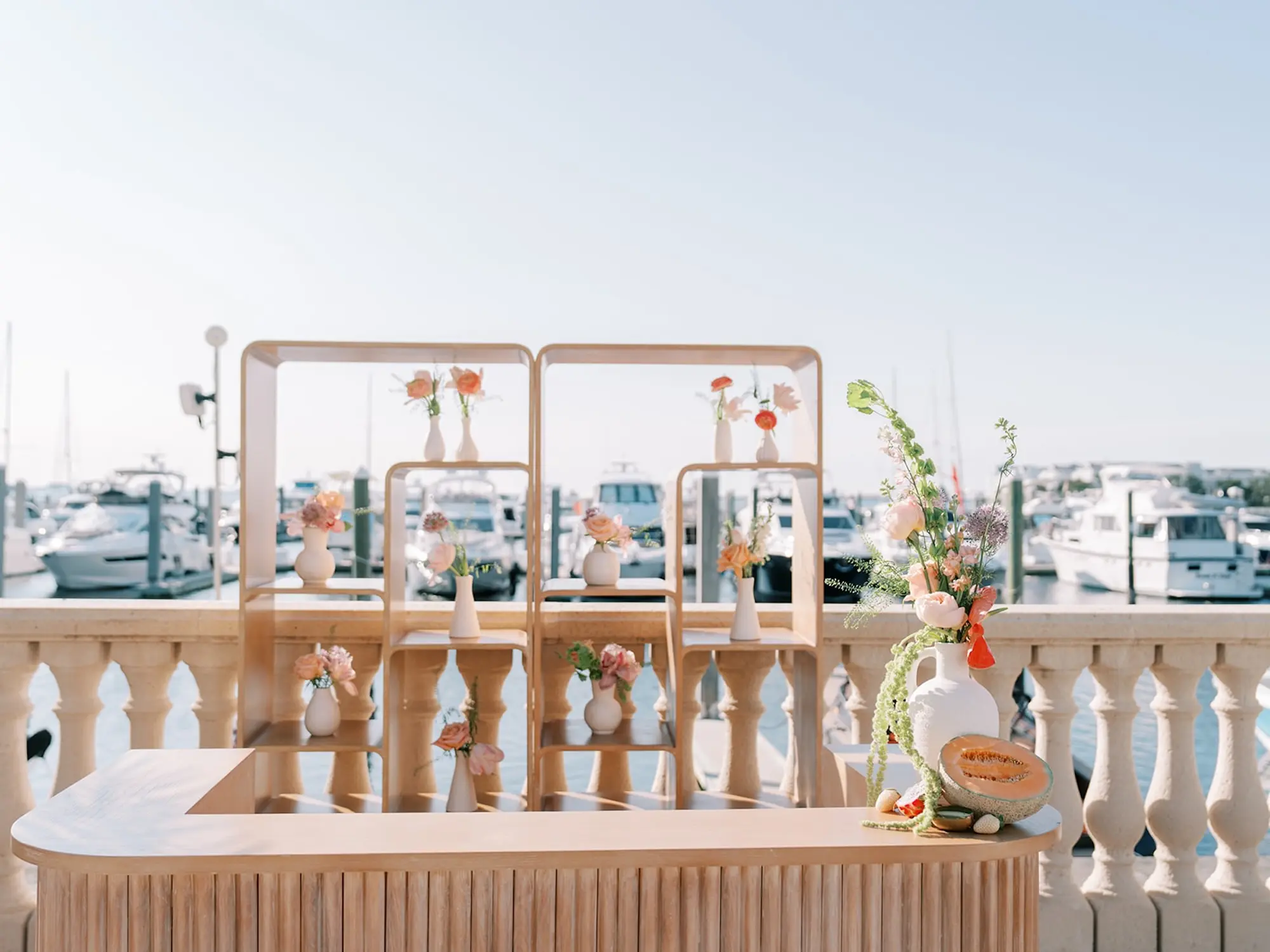 Geometric White Washed Wood Bar Wedding Reception Decor Inspiration | Tropical Coral, Pink and White Orchids, Anthium, Ranunculus Reception in Bud Vases Decor Ideas | Vibrant Fruit Dragon Fruit, Kiwi, Melon Decor Inspiration | Tampa Bay Florist Save The Date Florida | Central Florida Event Planner MDP Events | Waterfront Wedding Venue Westshore Yacht Club