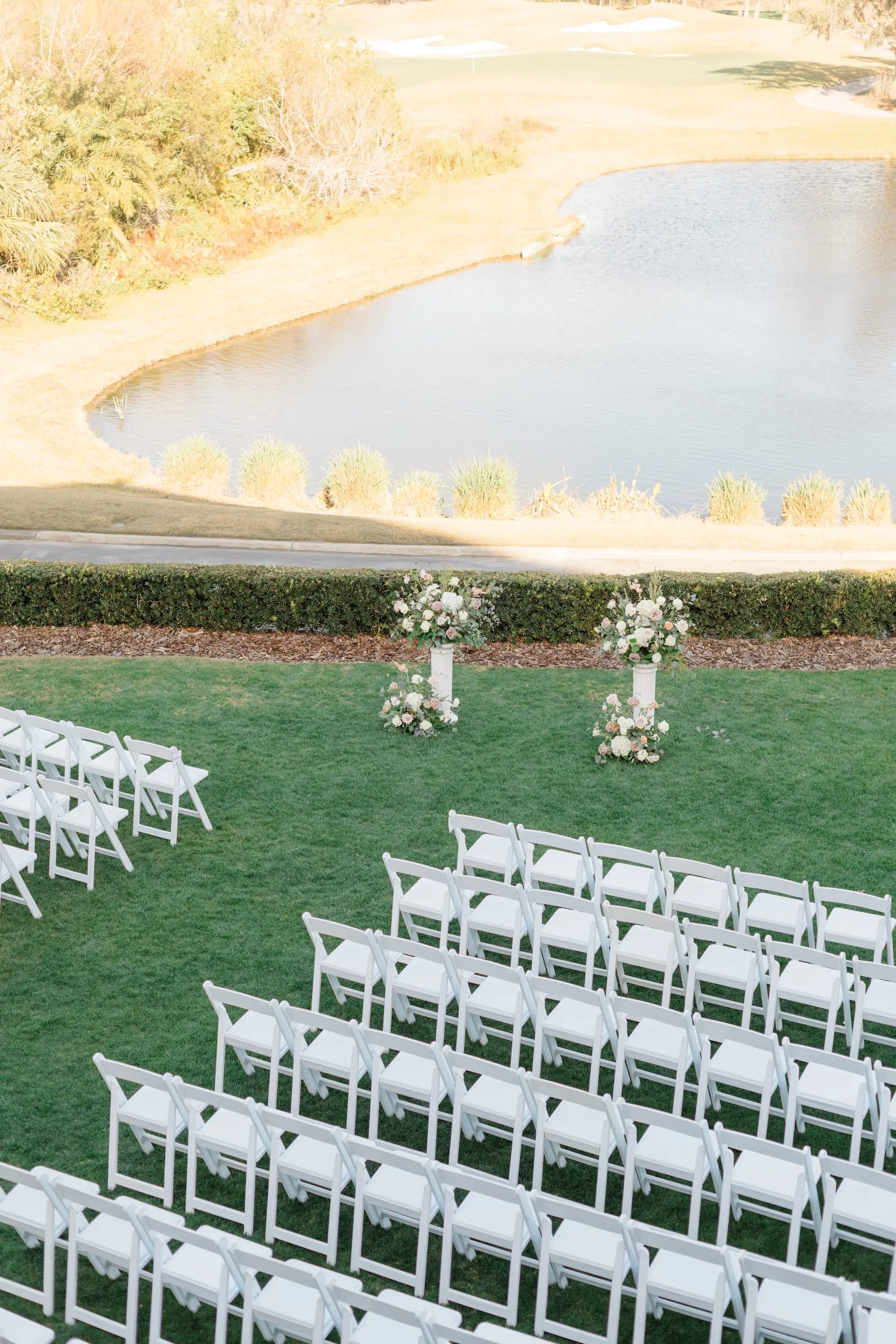 18Romantic Pastel and Navy Sarasota Wedding Inspiration Lakewood Ranch Country Club jpg - Timeless Gold and Green Sarasota Wedding | Lakewood Ranch Golf & Country Club Outdoor Country Club Estate Wedding Ceremony Inspiration | White Chairs Wedding Ceremony Ideas | Grecian Column Altar Ceremony Decor with Lush Floral Arrangements Decor Inspiration | Lakefront Wedding Ceremony Ideas | Sarasota Wedding Venue Lakewood Ranch Golf and Country Club