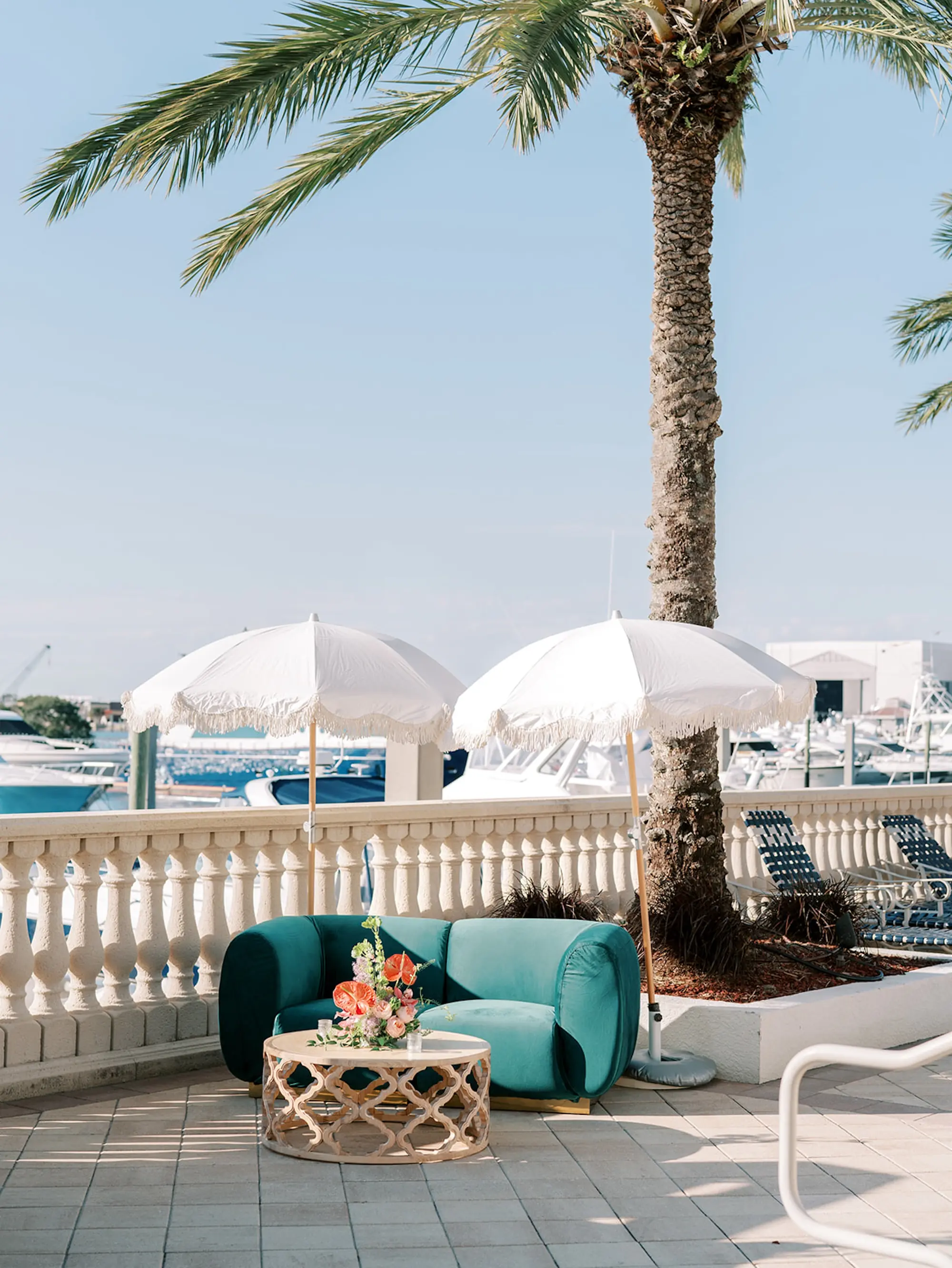 South Tampa Waterfront Wedding Venue Westshore Yacht Club | Tropical Boho Wedding Reception Seating Decor Inspiration | Coastal Fringed Umbrella Decor Ideas | Central Florida Event Planner MDP Events