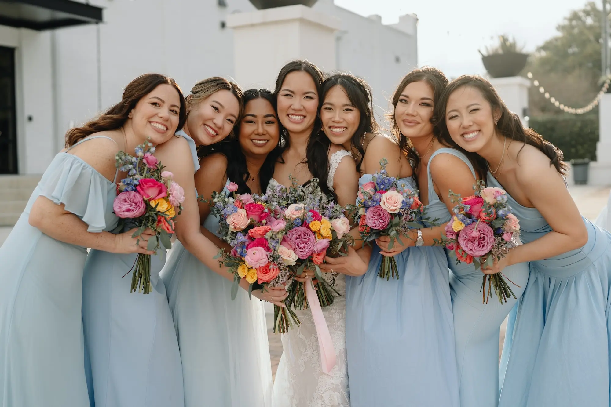 Mismatched Blue Bridesmaids Dress Inspiration | Vibrant Spring Bouquet Ideas | Pink, Purple, Blue, and Yellow Flowers