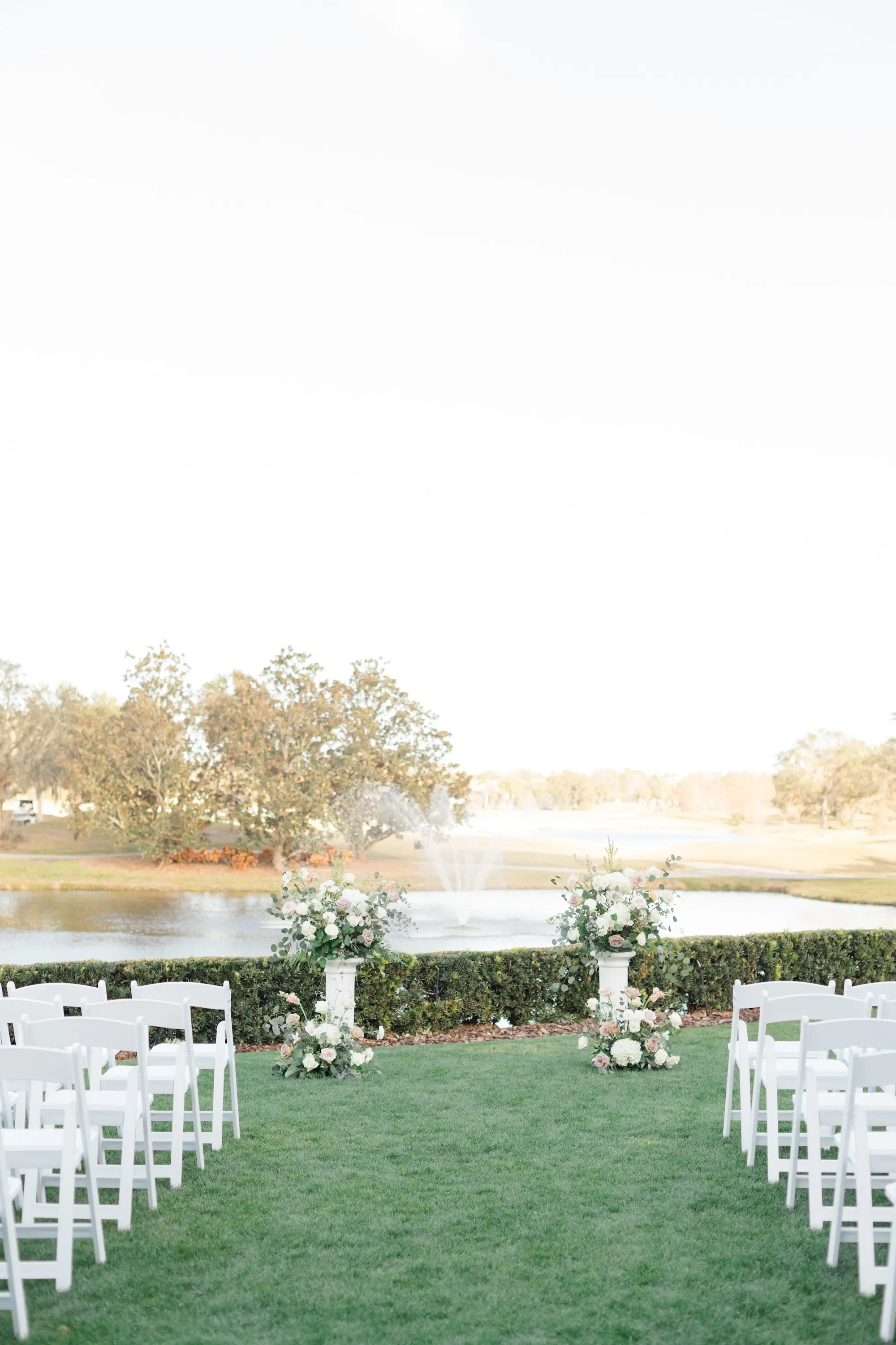 22Romantic Pastel and Navy Sarasota Wedding Inspiration Lakewood Ranch Country Club jpg - Timeless Gold and Green Sarasota Wedding | Lakewood Ranch Golf & Country Club Outdoor Country Club Estate Wedding Ceremony Inspiration | White Chairs Wedding Ceremony Ideas | Grecian Column Altar Ceremony Decor with Lush Floral Arrangements Decor Inspiration | Lakefront Wedding Ceremony Ideas | Sarasota Wedding Venue Lakewood Ranch Golf and Country Club