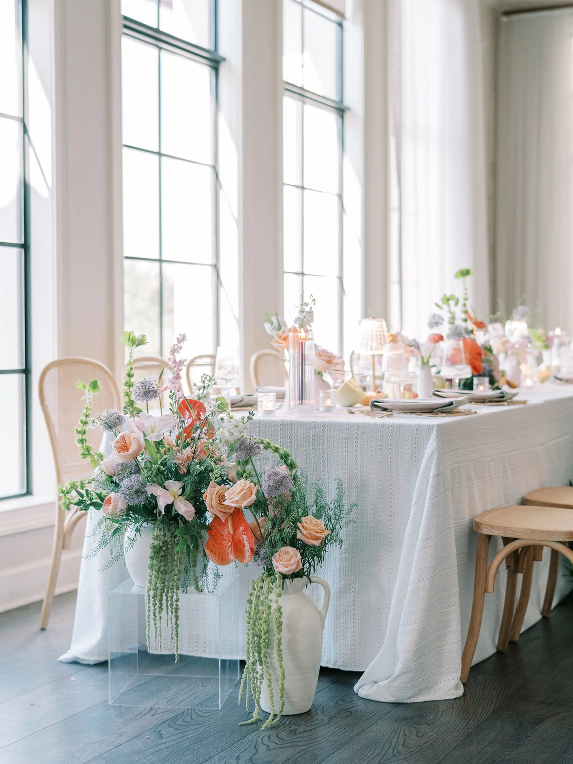 25Elegant Pastel Tropical Wedding Inspriation jpg - “Best Of” 2025: Wedding Receptions Part 2 Luxurious Old Florida Ballroom Wedding Reception Portrait | Long Wedding Reception Table with Wicker Chairs with White Textured Linens with Bud Vases and Romantic Tea Candles Reception Decor Inspiration | Tropical Coral, Pink and White Orchids, Anthium, Ranunculus Reception Centerpiece Inspiration | Vibrant Fruit Dragon Fruit, Kiwi, Melon Table Decor Ideas | Tampa Bay Florist Save The Date Florida | Central Florida Event Planner MDP Events | Tampa Bay Over The Top Rental Linens | Wedding Venue Westshore Yacht Club