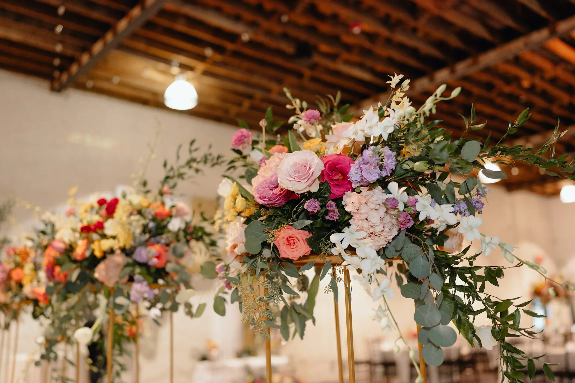 Vibrant Pink and Purple Flowers with Greenery Wedding Reception Centerpiece Decor Ideas