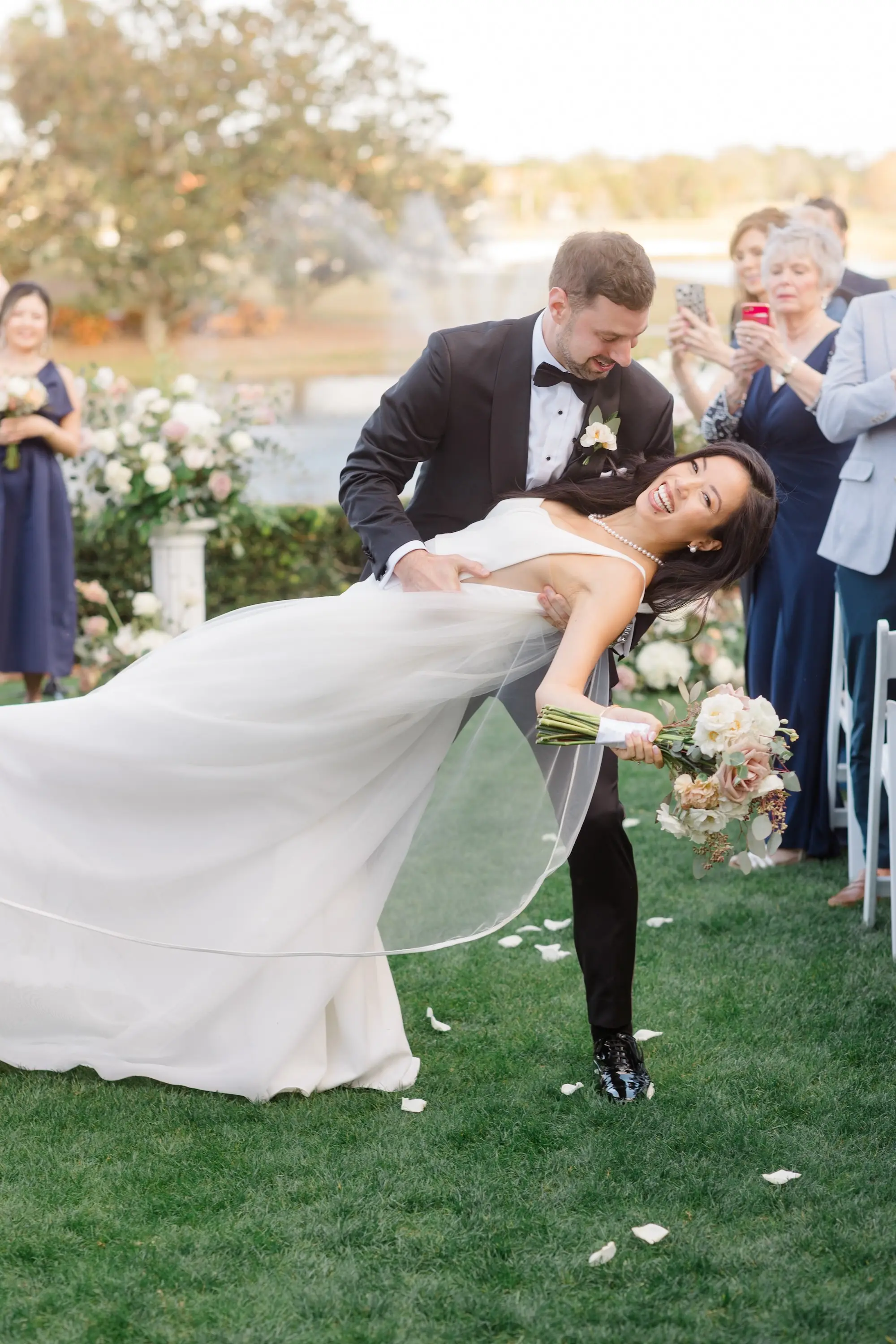 30Romantic Pastel and Navy Sarasota Wedding Inspiration jpg - Timeless Gold and Green Sarasota Wedding | Lakewood Ranch Golf & Country Club Bride and Groom in Wedding Ceremony Aisle Wedding Portrait | Elegant Paloma Blanca Wedding Gown with Traditional Chapel Length Tulle Veil Inspiration | Susan Elizabeth Weddings Tampa Wedding Photographer