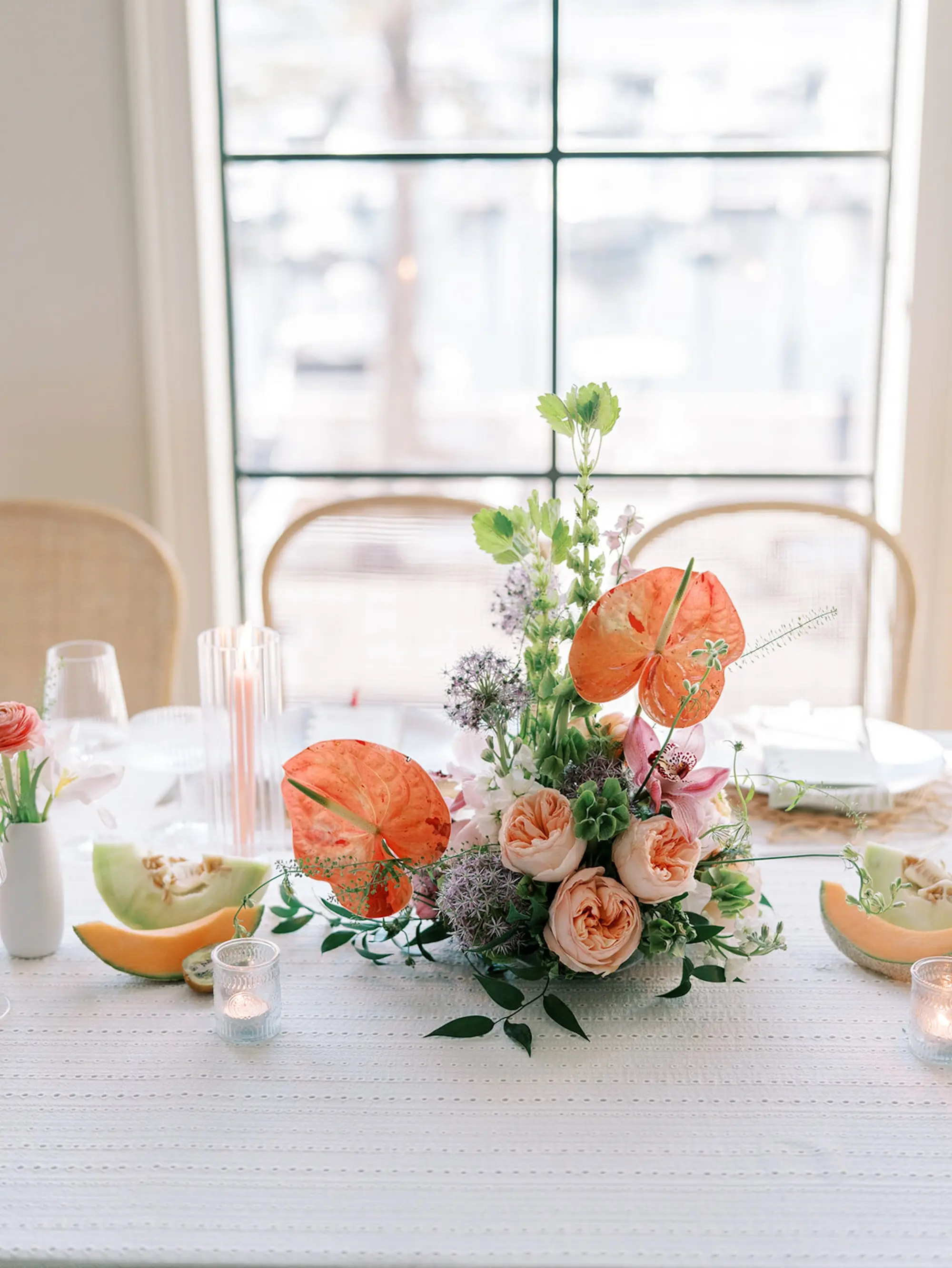 31Elegant Pastel Tropical Wedding Inspriation jpg - “Best Of” 2025: Wedding Receptions Part 2 Tropical Coral, Pink and White Orchids, Anthium, Ranunculus Wedding Reception Centerpiece Inspiration | Vibrant Fruit Dragon Fruit, Kiwi, Melon Table Decor Ideas | White Textured Linens with Bud Vases and Romantic Tea Candles Reception Decor Inspiration | Tampa Bay Florist Save The Date Florida | Central Florida Event Planner MDP Events | Tampa Bay Over The Top Rental Linens