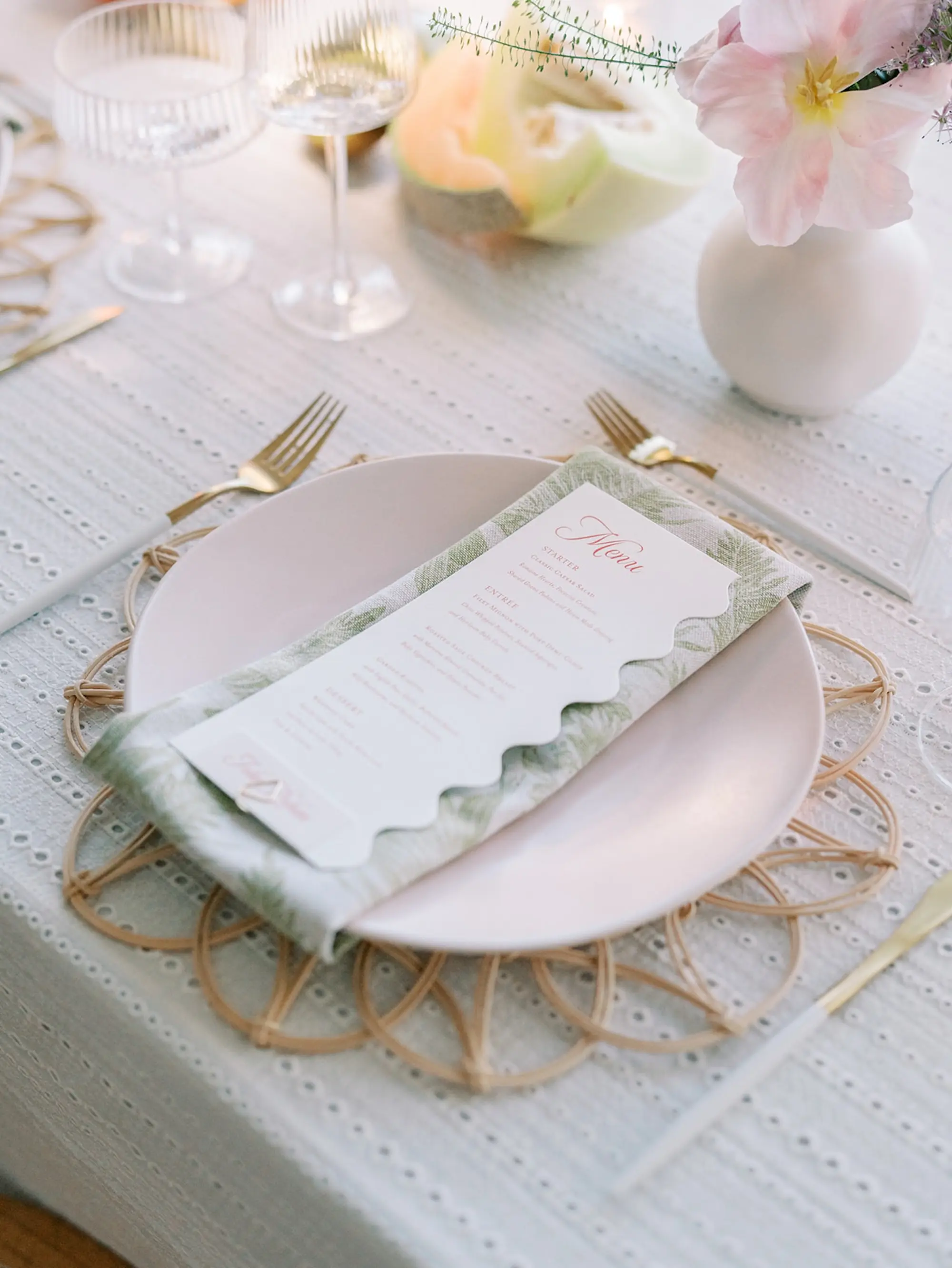 32Elegant Pastel Tropical Wedding Inspriation jpg - “Best Of” 2025: Wedding Receptions Part 2 Light Shell Pink Plates on Wicker Charger with Gold Flatware and Tropical Palm Detailed Cloth Napkin and White Menu Card with Bright Pink Writing Wedding Reception Decor Inspiration | White Textured Linens with Bud Vases of Tropical Florals and Romantic Tea Candles Reception Decor Inspiration | Tampa Bay Florist Save The Date Florida | Central Florida Event Planner MDP Events | Tampa Bay Over The Top Rental Linens