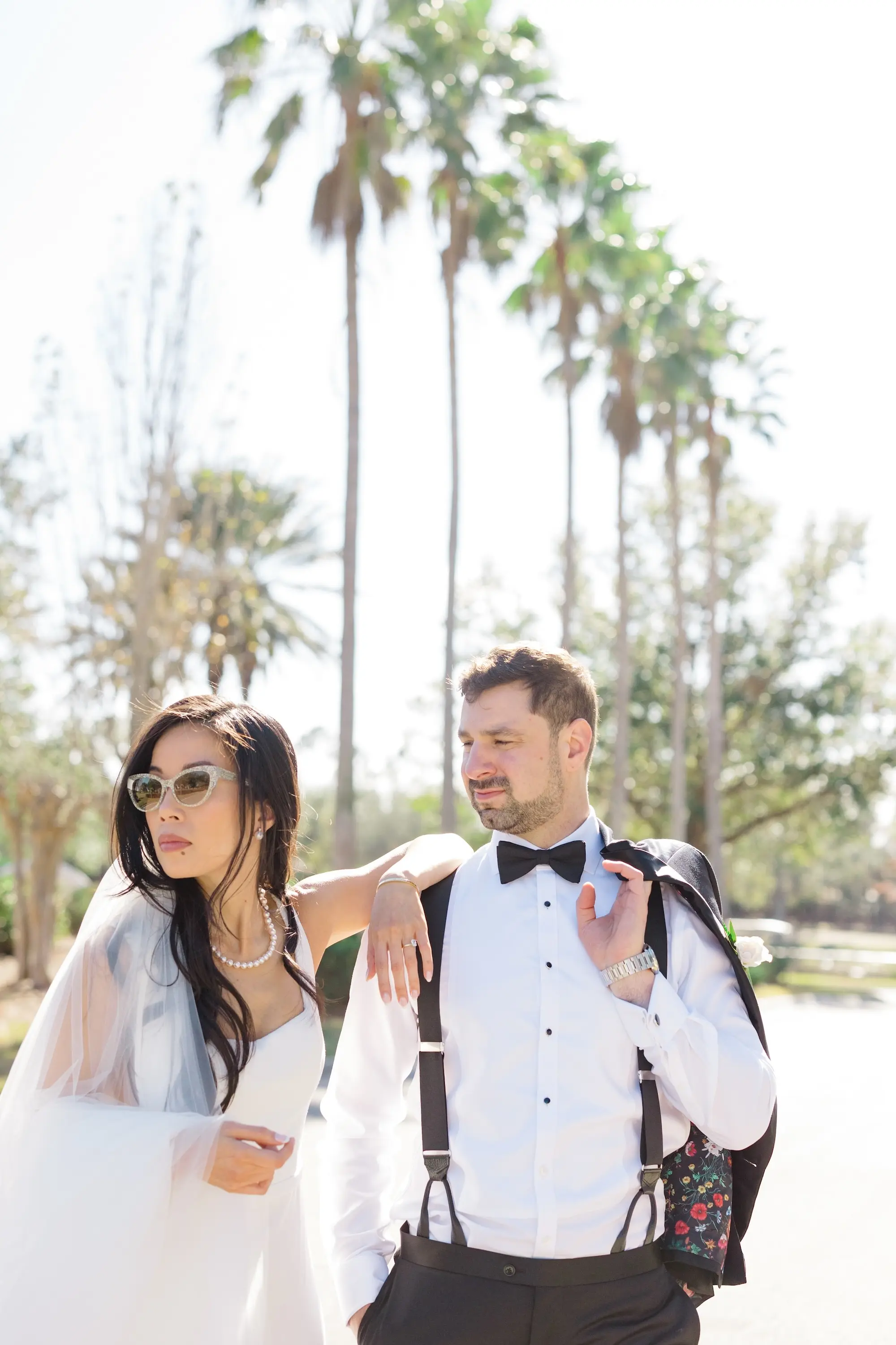 32Romantic Pastel and Navy Sarasota Wedding Inspiration jpg - “Best Of” 2025: Wedding Portraits Bride and Groom Casual Wedding Portrait | Bride in Cateye Sunglasses with Pearl Necklace and Square Neckline Wedding Gown Inspiration | Traditional Black and White Groom Tuxedo with Bowtie Ideas | Susan Elizabeth Weddings Tampa Wedding Photographer