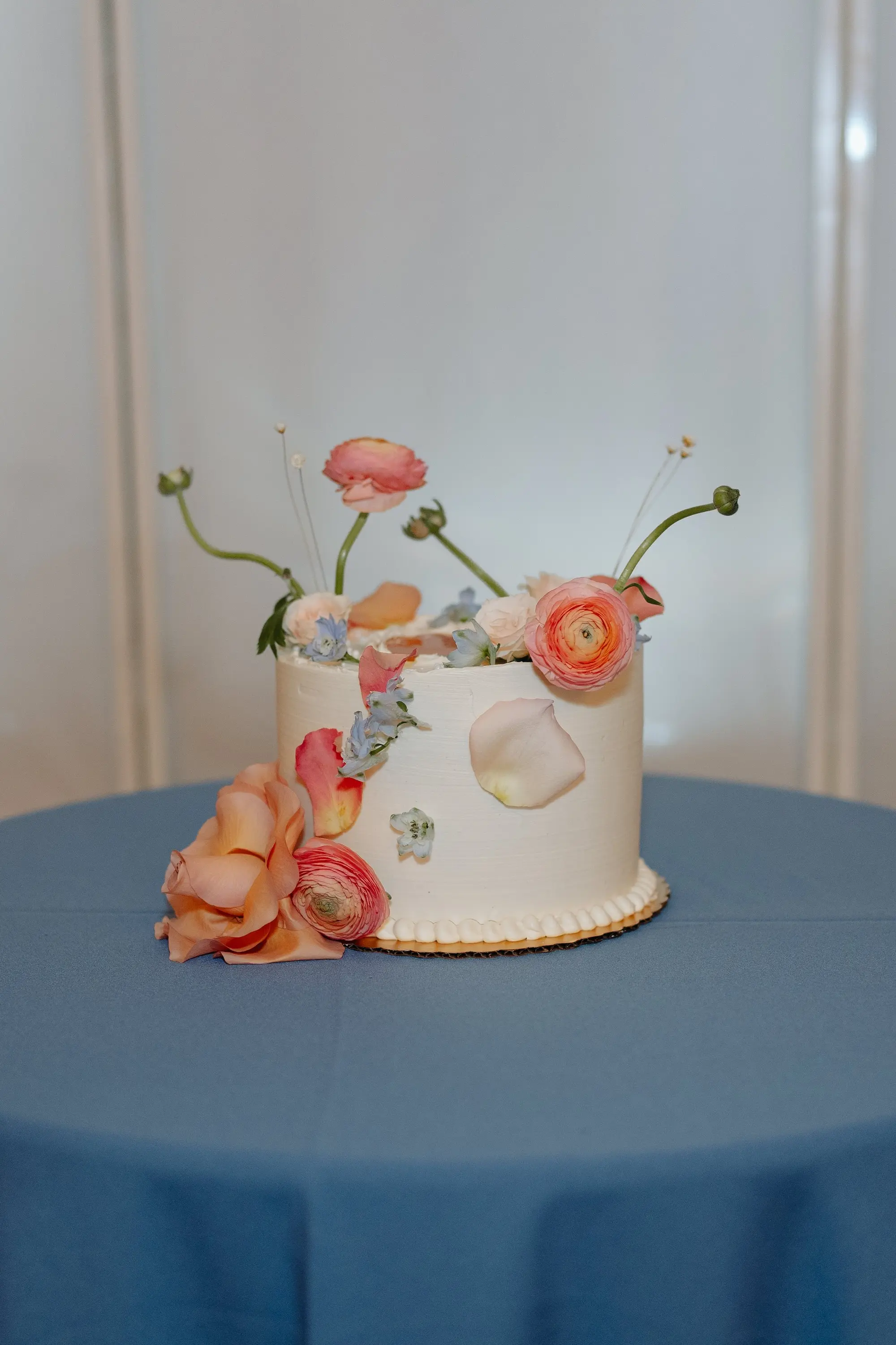 Romantic Modern Single-Tiered Wedding Cake with Orange and Blue Floral Decor Inspiration