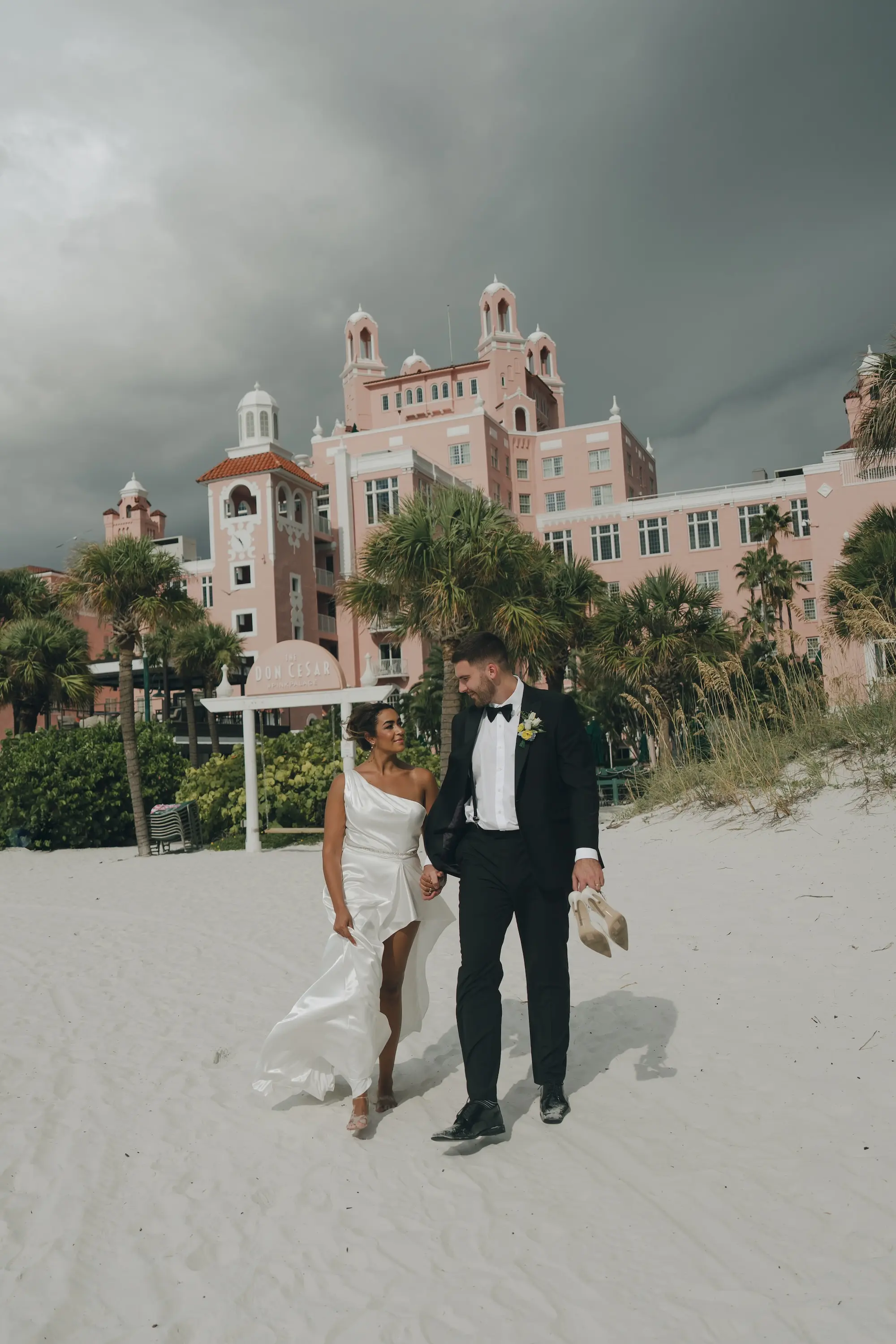 Bride and Groom Just Married Wedding Portrait | White Satin Reception Dress Ideas | Tampa Bay Boutique Truly Forever Bridal | Videographer Iyrus Weddings | Content Creator Behind The Vows | St Pete Event Venue The Don CeSar