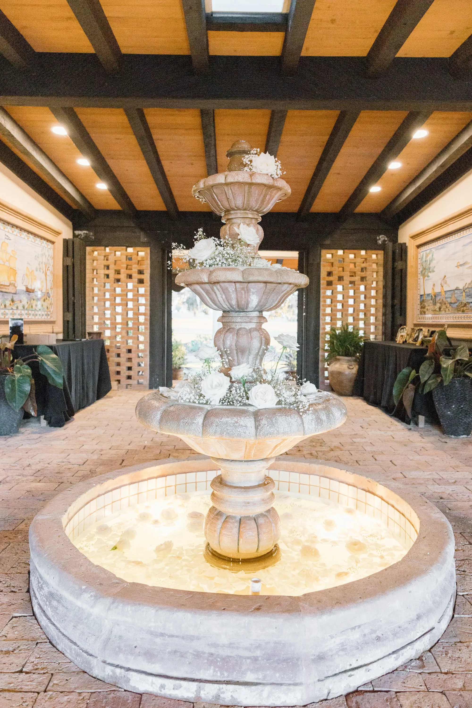 Outdoor European Inspired Black and White Winter Wedding Inspiration | Stone Fountain with Baby's Breath and White Roses Wedding Reception Decor Ideas | Brooksville Event Venue La Hacienda on Snow Hill | Black and White Classic European Style Estate Wedding Inspiration