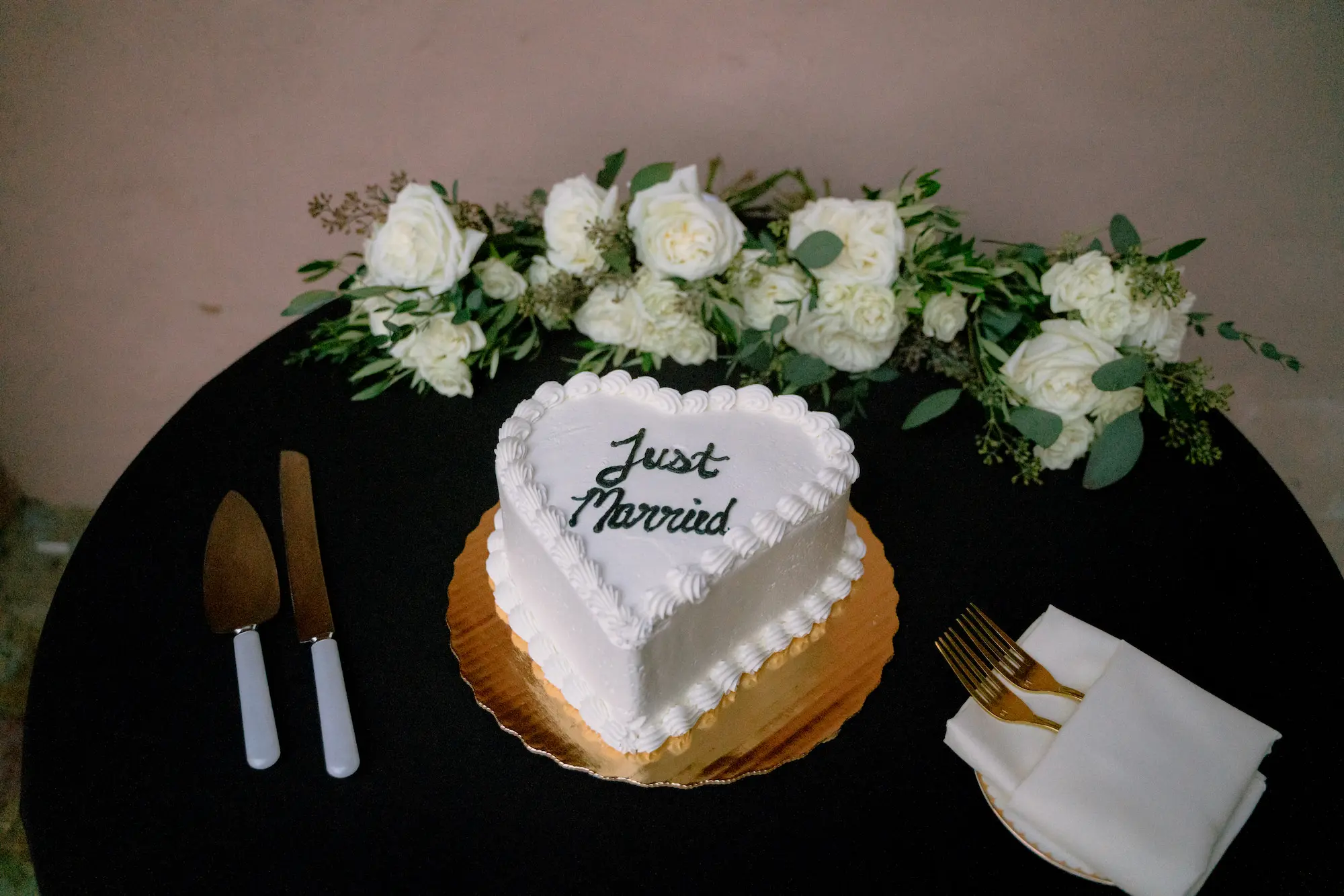 Just Married Single-Tiered Heart Wedding Cake Inspiration | White Flowers and Greenery Decor Ideas