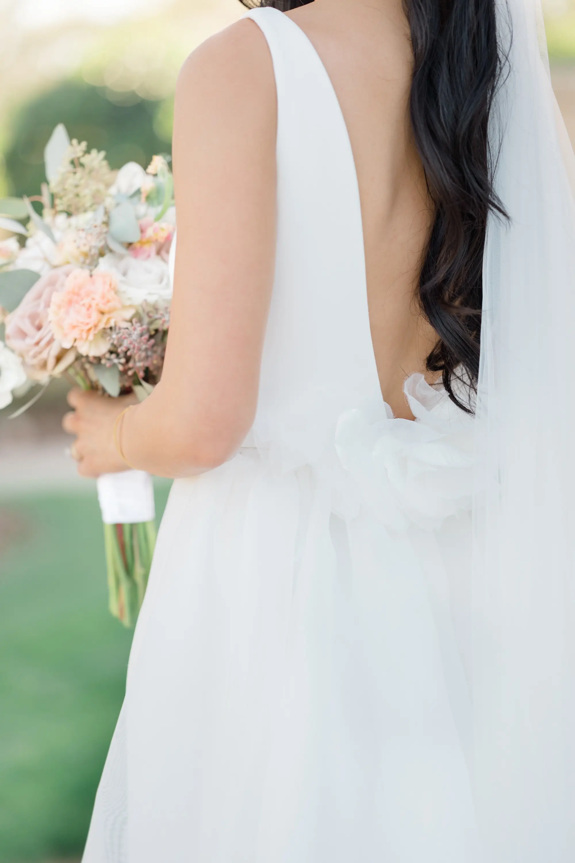 38Romantic Pastel and Navy Sarasota Wedding Inspiration jpg - “Best Of” 2025: Wedding Portraits Bride with Low Back and Bow Detail Wedding Portrait | Susan Elizabeth Weddings Tampa Wedding Photographer