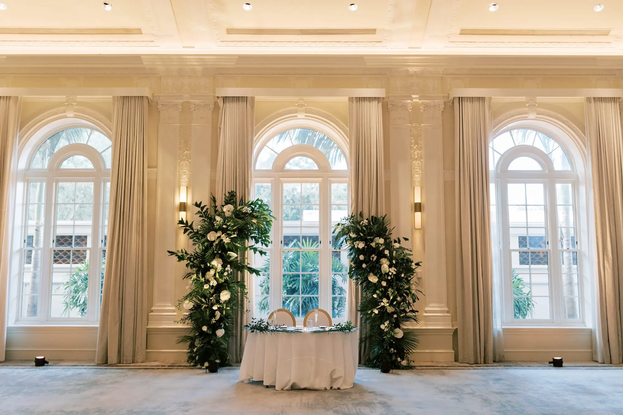 White and Green Elegant Tropical Ballroom Wedding Reception Sweetheart Table Decor Ideas with Greenery Arch | St Pete Event Venue The Vinoy | Florist Lemon Drops