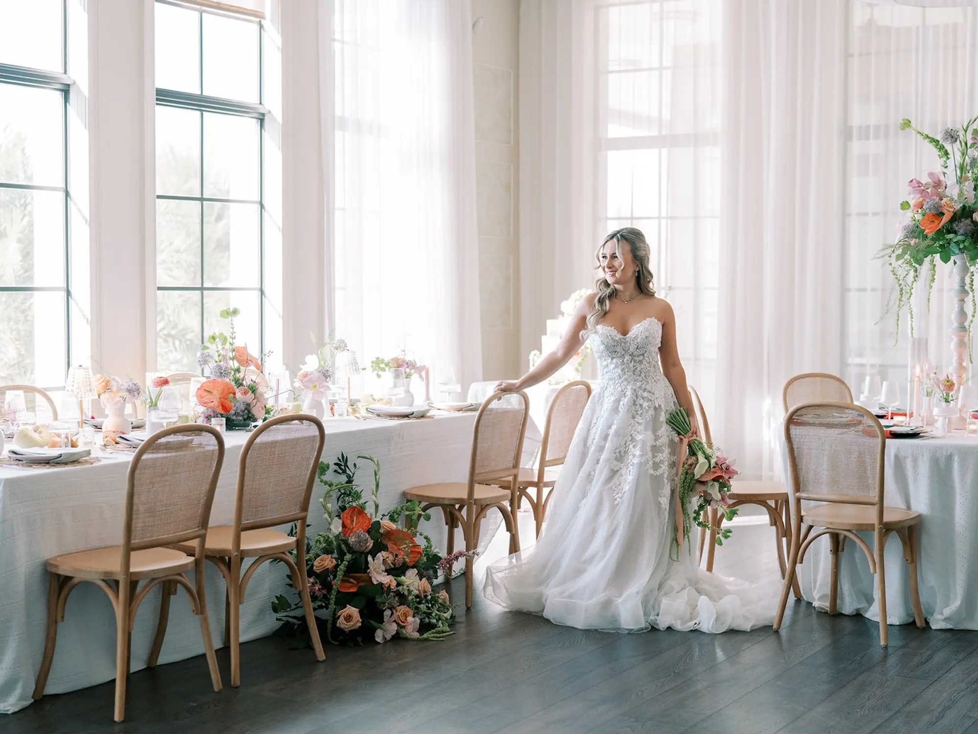 Bridal Wedding Photo | Wicker Chairs and White Floral Detailed Texture Linens Wedding Reception Decor Ideas | Tropical Coral, Pink and White Orchids, Anthium, Ranunculus Bridal Bouquet Inspiration | Tampa Bay Florist Save The Date Florida | Soft Beach Curls Half Up Half Down Wedding Hair Ideas | Tampa Bay Wedding Hair and Makeup Artist Adore Bridal Hair and Makeup | South Tampa Photographer Eddy Almaguer Photography | Strapless A-Line Tulle Wedding Gown with Sweetheart Neckline and Floral Lace Inspiration | Tampa Bay Over The Top Rental Linens