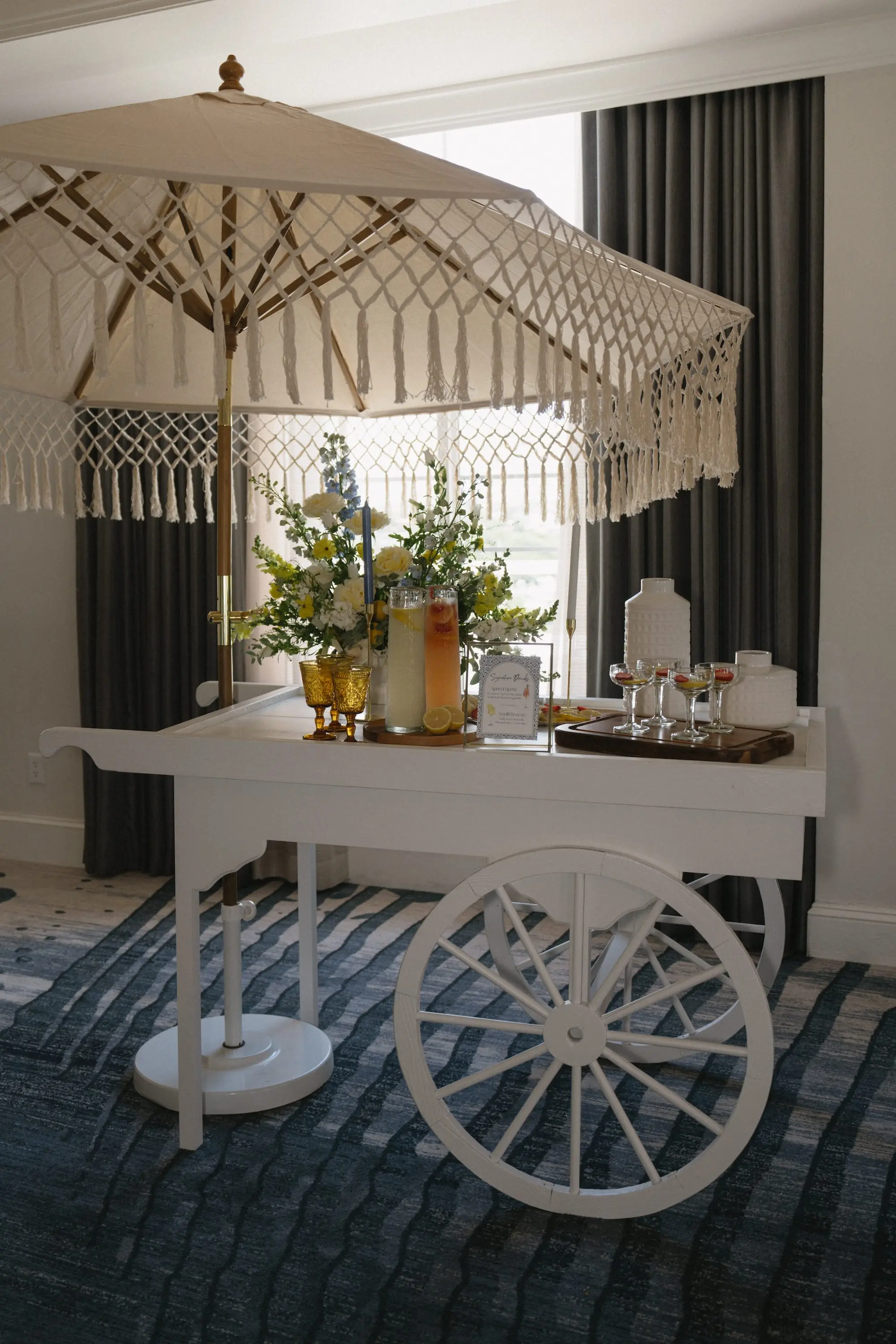 Wedding Reception Romantic White Drink Cart with Tasseled Umbrella Inspiration | Lemonade and Ice Tea Drink Decor Ideas | Timeless Italian Inspired Wedding Reception Decor with White and Yellow Floral Inspiration | Kate Ryan Event Rentals | Tampa Bay Planner Planner Coastal Coordinating