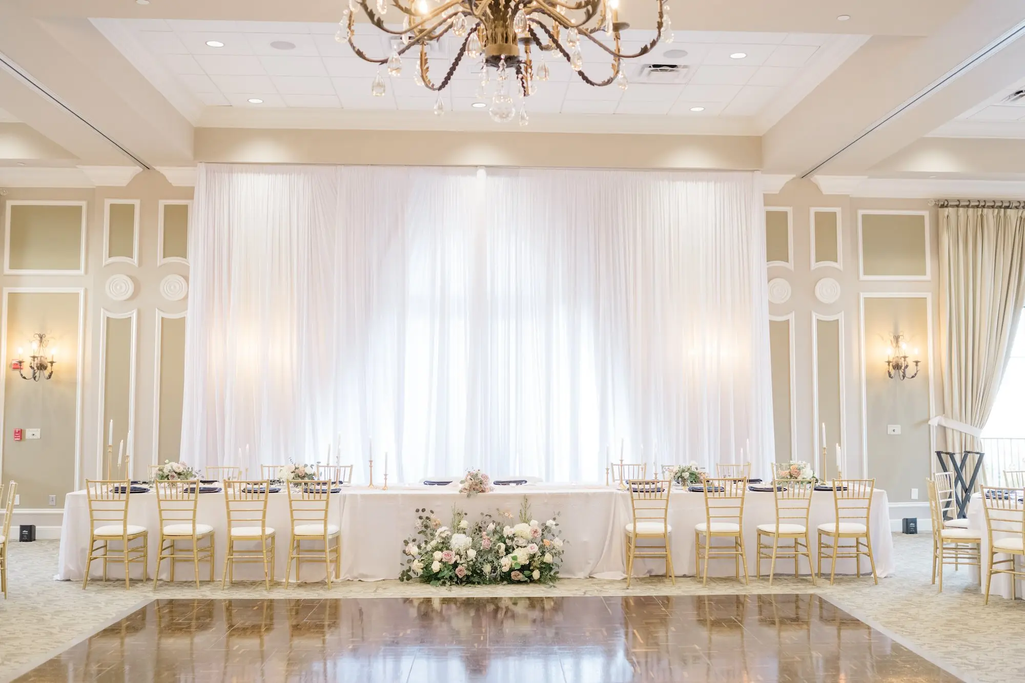 44Romantic Pastel and Navy Sarasota Wedding Inspiration Lakewood Ranch Country Club jpg - Timeless Gold and Green Sarasota Wedding | Lakewood Ranch Golf & Country Club Luxurious Ballroom Wedding Reception | Modern Gold Chairs at Long Head Table with White Linens Inspiration | Short Lush Centerpieces with White and Blush Roses, Hydrangeas and Eucalyptus Flower Arrangement Ideas | Sarasota Wedding Venue Lakewood Ranch Golf and Country Club