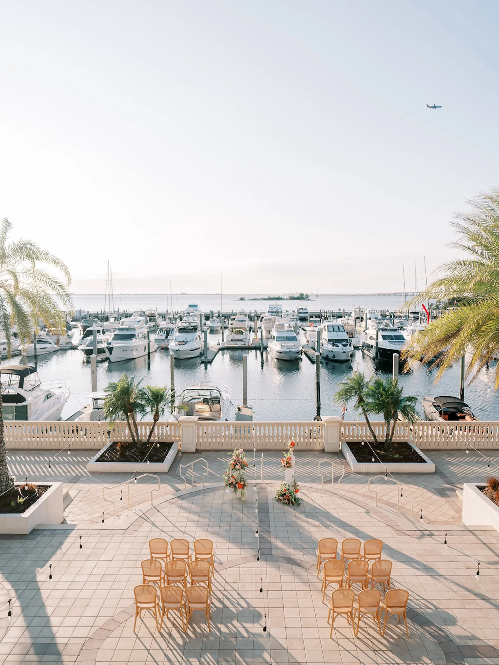 Outdoor Waterfront Wedding Ceremony Venue Inspiration | Wicker Wedding Ceremony Chairs Ideas | South Tampa Wedding Venue Westshore Yacht Club | Central Florida Event Planner MDP Events