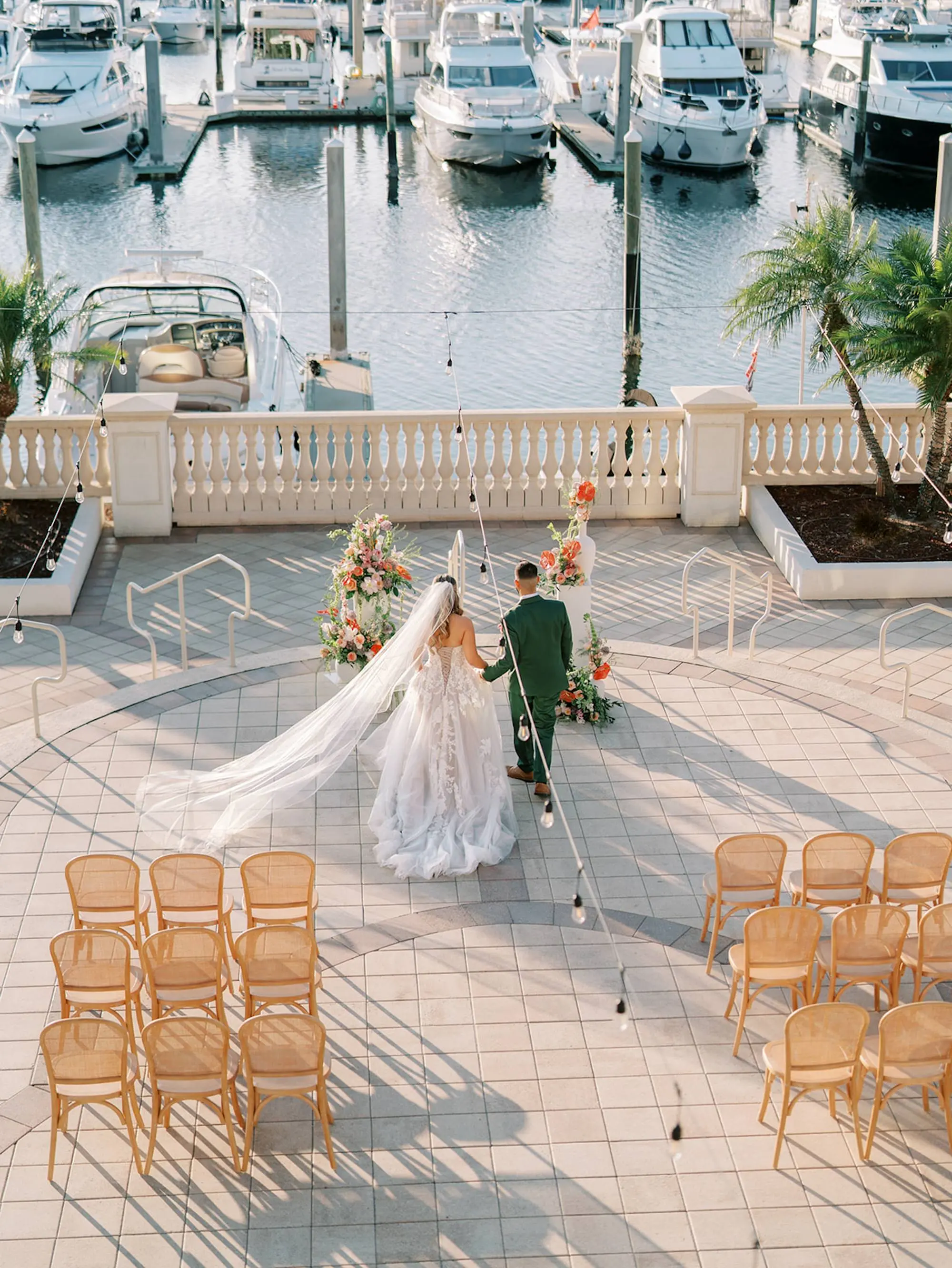 Bride and Groom Wedding Ceremony Portrait | Outdoor Waterfront Ceremony Venue Inspiration | Wicker Wedding Ceremony Chairs Ideas | Tropical Florals Altar Decor Inspiration | Tampa Bay Florist Save The Date Florida | South Tampa Wedding Venue Westshore Yacht Club | Central Florida Event Planner MDP Events | South Tampa Photographer Eddy Almaguer Photography