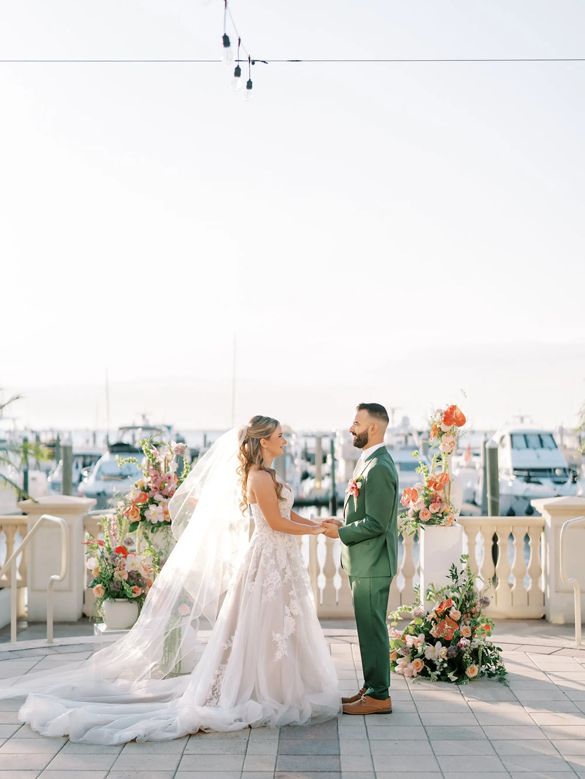 Bride and Groom Wedding Ceremony Vow Exchange Wedding | Outdoor Waterfront Ceremony Venue Inspiration | Wicker Wedding Ceremony Chairs Ideas | Tropical Florals Altar Decor Inspiration | Tampa Bay Florist Save The Date Florida | South Tampa Wedding Venue Westshore Yacht Club | Central Florida Event Planner MDP Events | South Tampa Photographer Eddy Almaguer Photography