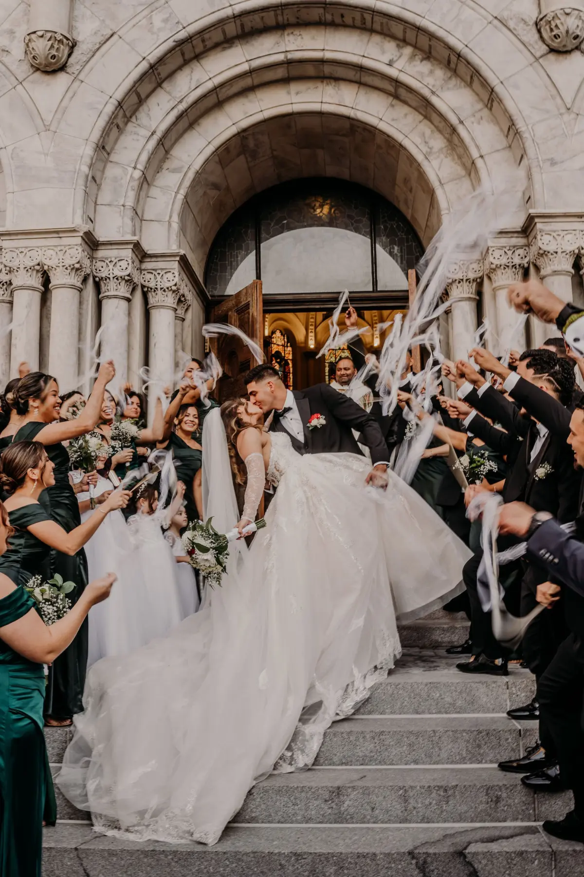 17Classic Gold Italian Inspired Wedding Ideas - Classic, Gold Tampa Wedding | The Italian Club of Tampa Bride and Groom Streamer Exit Kissing on Steps of Sacred Heart Catholic Church Wedding Ceremony Venue | Traditional Catholic Wedding Ceremony Event Ideas | Tampa Bay Photographer Videographer Sabrina Autumn Photography