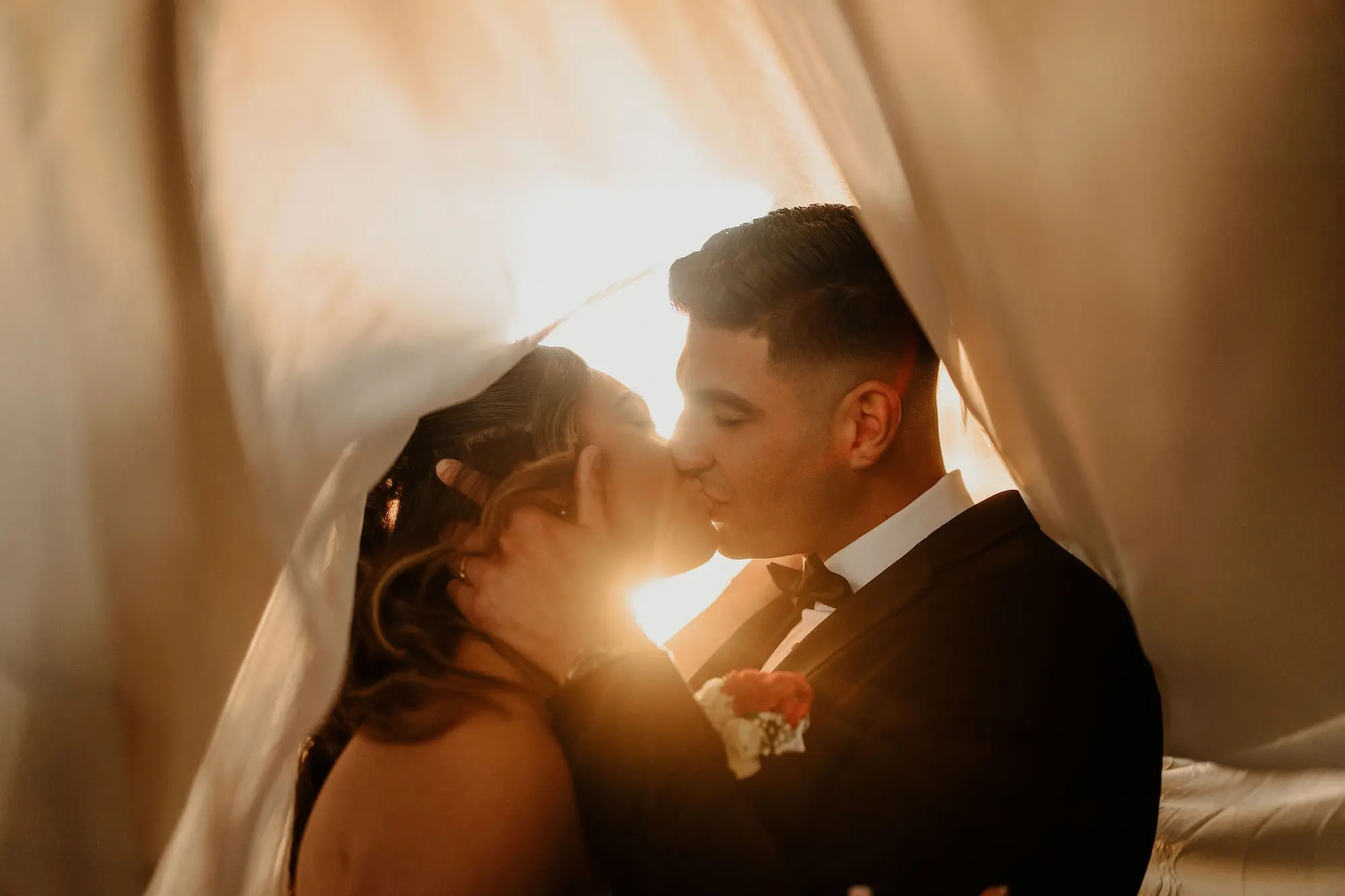 21Classic Gold Italian Inspired Wedding Ideas - Classic, Gold Tampa Wedding | The Italian Club of Tampa Bride and Groom Golden Hour under Veil Kissing Wedding Portrait | Tampa Bay Photographer Videographer Sabrina Autumn Photography