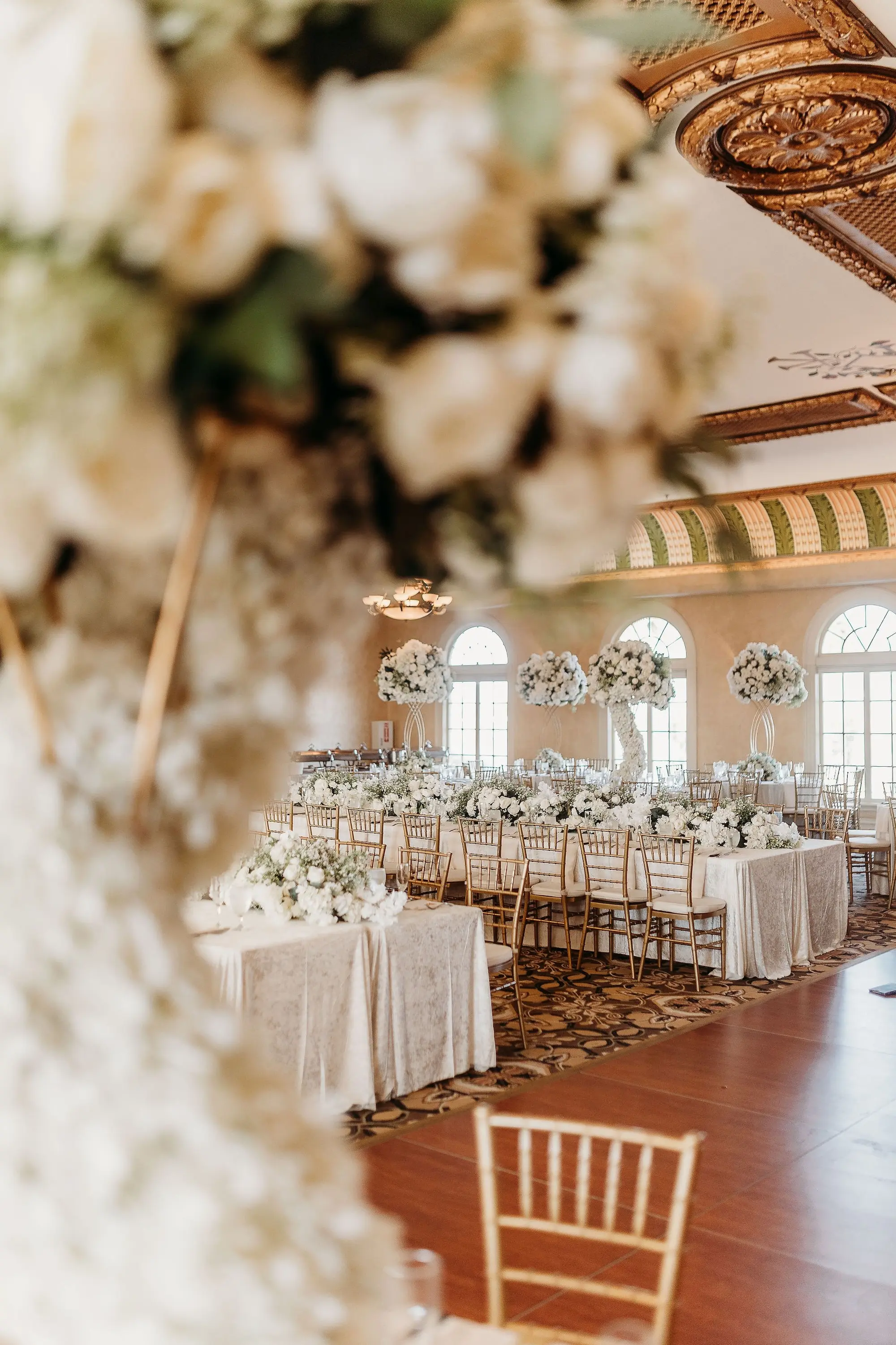 30Classic Gold Italian Inspired Wedding Ideas Tampa Venue Italian Club - Classic, Gold Tampa Wedding | The Italian Club of Tampa Elegant Old World Italian Inspired Ballroom Wedding Reception | Chiavari Gold Chairs | Tall Gold Lush Centerpieces with White Hydrangeas, Roses, and Baby's Breath with Greenery and White Rose Cascading Base Flower Arrangement Ideas | Downtown Tampa Ybor City Wedding Venue Italian Club