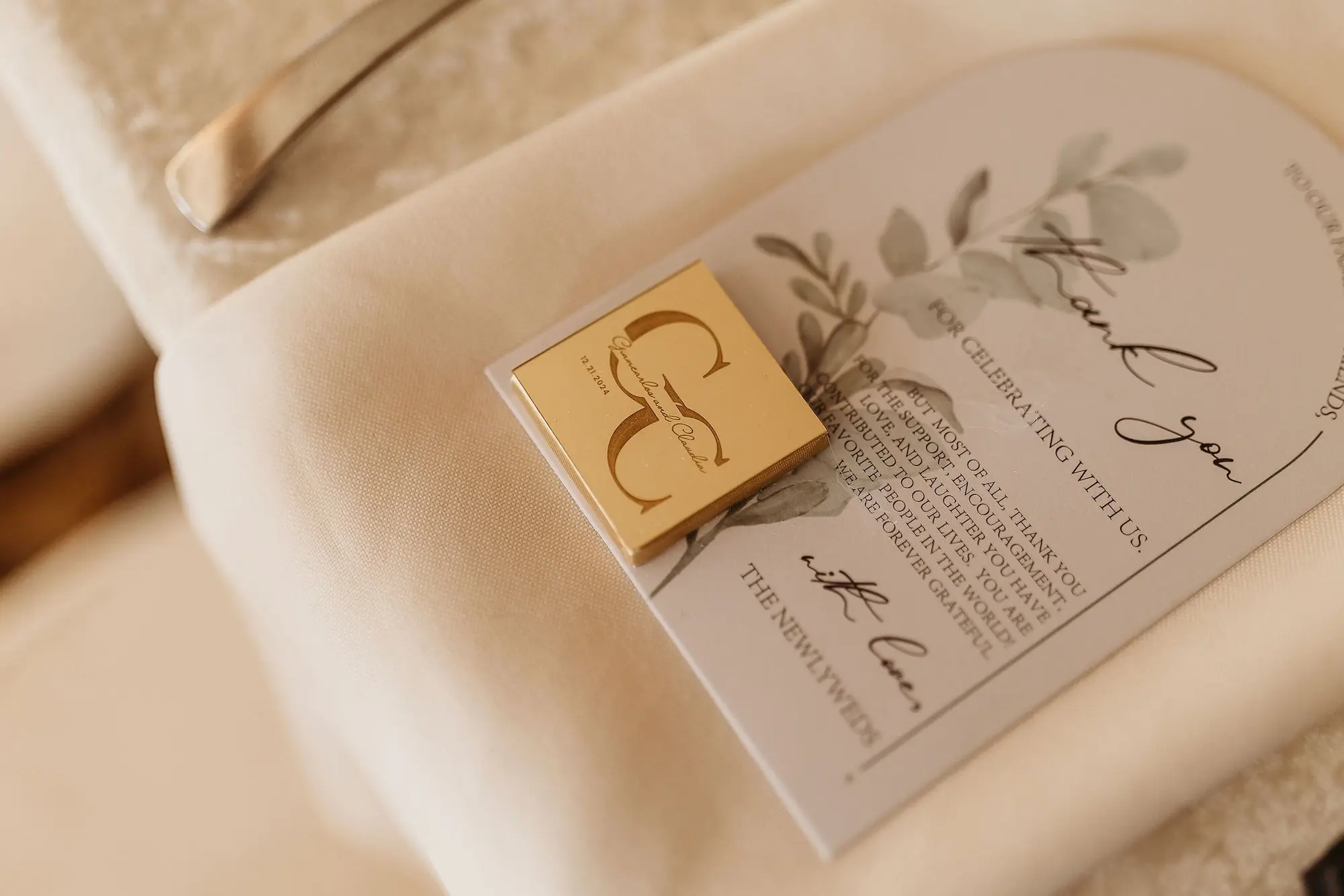 33Classic Gold Italian Inspired Wedding Ideas - Classic, Gold Tampa Wedding | The Italian Club of Tampa White Lace Tablecloth with White Napkin and Menu Card with Greenery Detail Wedding Reception Decor Inspiration | Gold Personalized Chocolate Wedding Favor Ideas