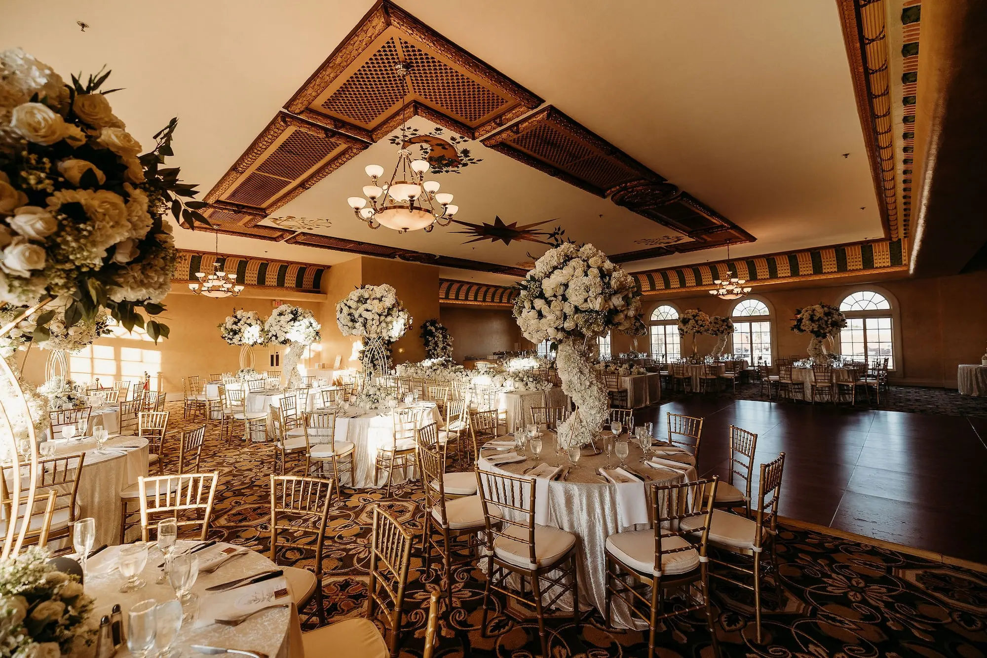 36Classic Gold Italian Inspired Wedding Ideas Tampa Venue Italian Club - Classic, Gold Tampa Wedding | The Italian Club of Tampa Elegant Old World Italian Inspired Ballroom Wedding Reception | Chiavari Gold Chairs | Tall Gold Lush Centerpieces with White Hydrangeas, Roses, and Baby's Breath with Greenery and White Rose Cascading Base Flower Arrangement Ideas | Downtown Tampa Ybor City Wedding Venue Italian Club