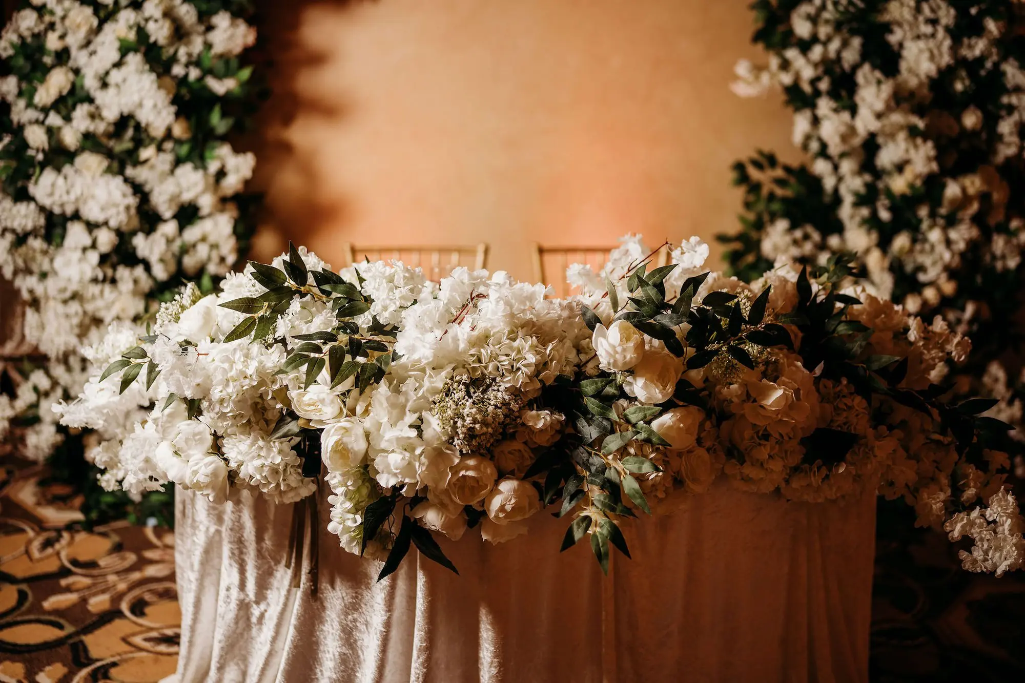 38Classic Gold Italian Inspired Wedding Ideas - Classic, Gold Tampa Wedding | The Italian Club of Tampa Elegant Old World Italian Inspired Ballroom Wedding Reception | Lush Centerpieces with White Hydrangeas, Roses, and Baby's Breath with Greenery Sweetheart Table Flower Arrangement Decor Ideas