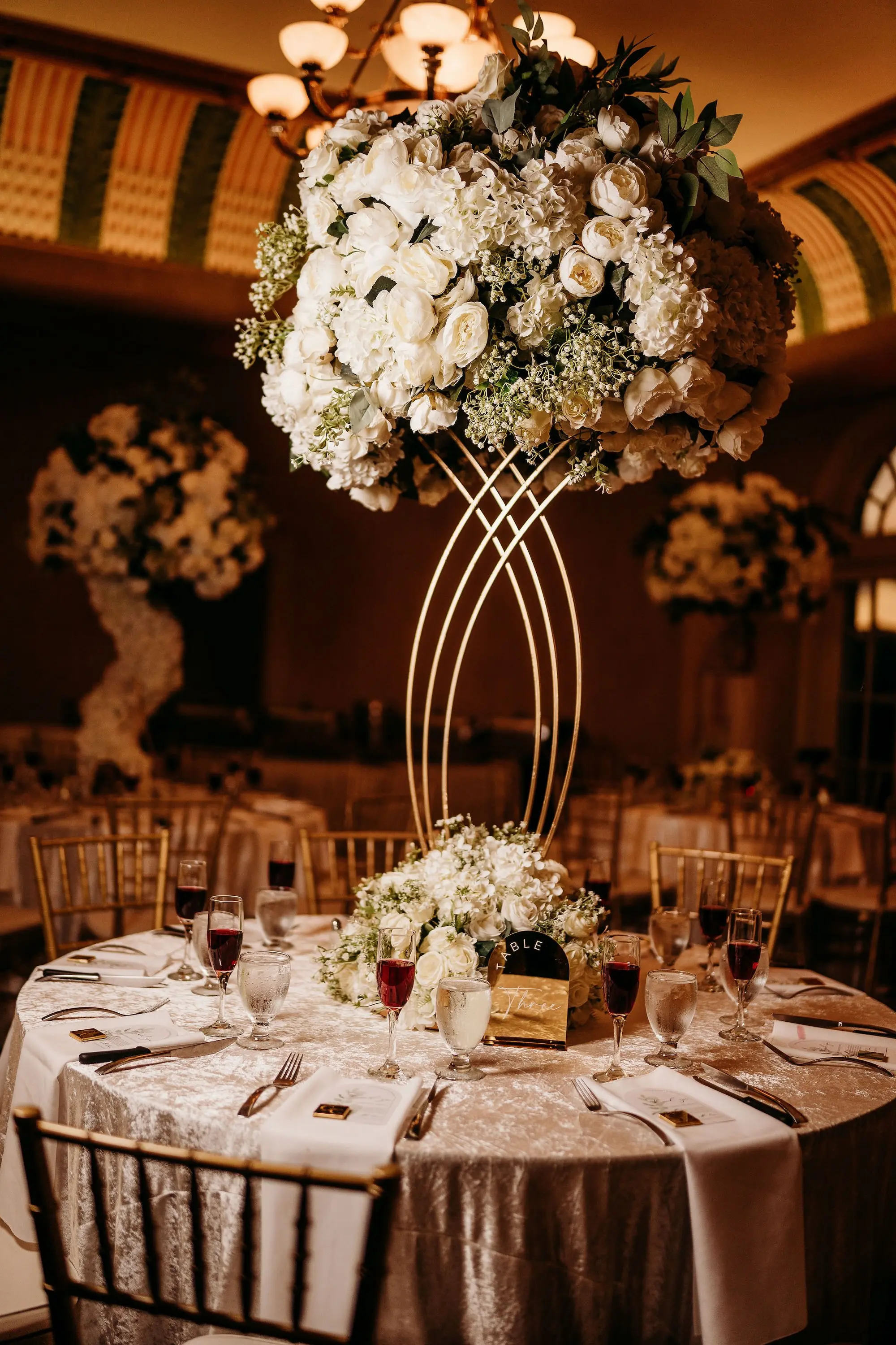 39Classic Gold Italian Inspired Wedding Ideas - Classic, Gold Tampa Wedding | The Italian Club of Tampa Elegant Old World Italian Inspired Ballroom Wedding Reception | Chiavari Gold Chairs | Tall Gold Lush Centerpieces with White Hydrangeas, Roses, and Baby's Breath with Greenery Flower Arrangement Ideas | Downtown Tampa Ybor City Wedding Venue Italian Club