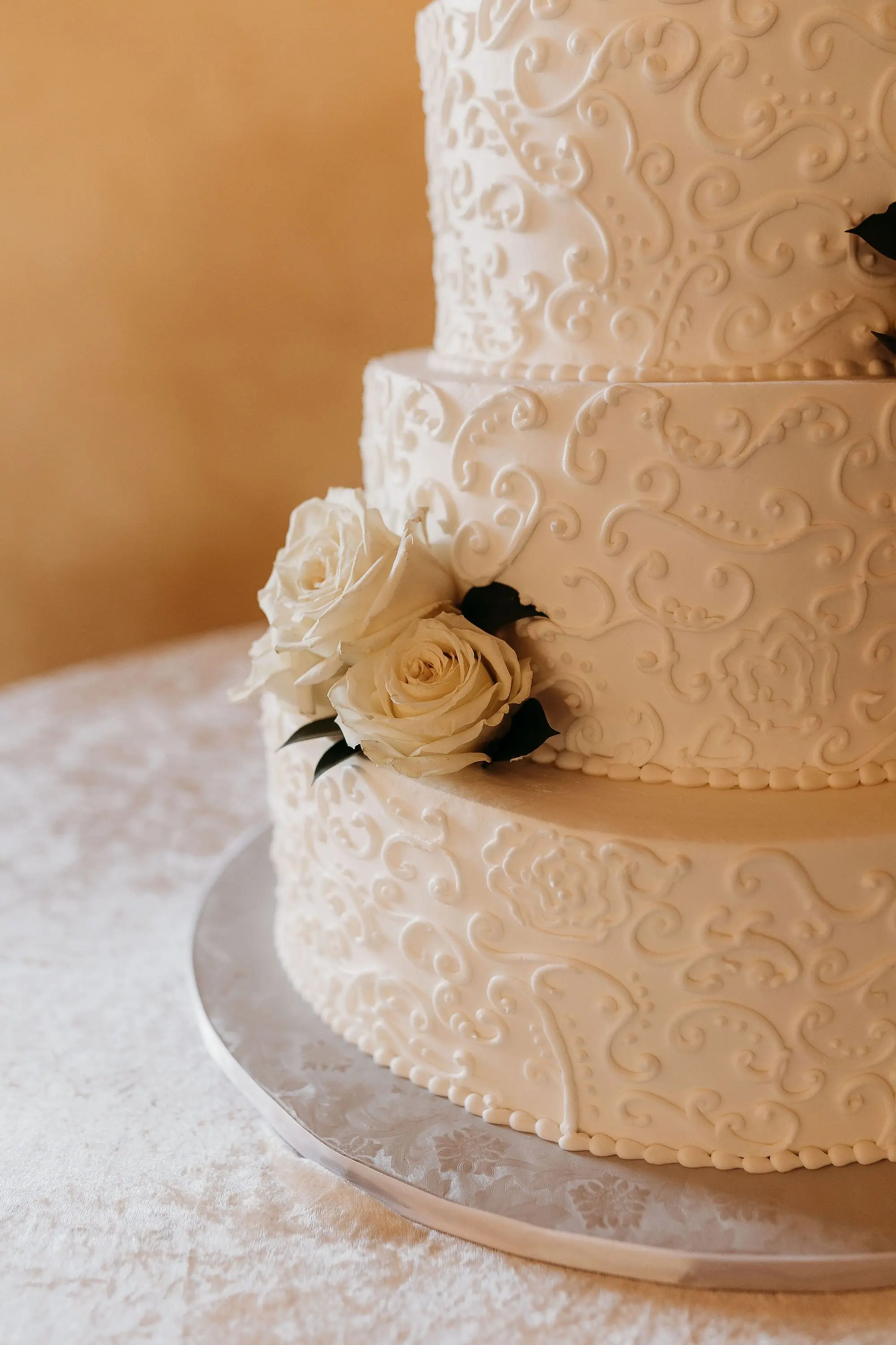 40Classic Gold Italian Inspired Wedding Ideas - Classic, Gold Tampa Wedding | The Italian Club of Tampa Elegant Vintage Multi-Tiered Intricate, White Piped Lace Wedding Cake with White Roses Decor Inspiration