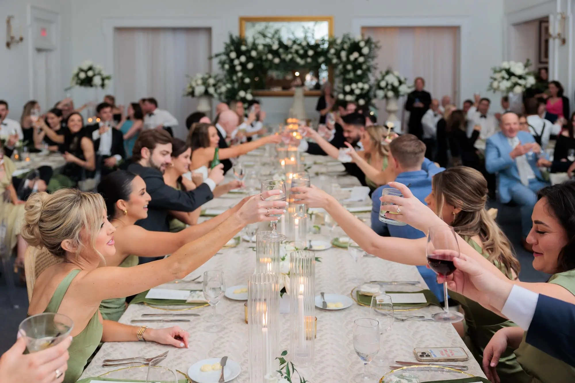 Timeless Green, White, and Gold Wedding Reception Inspiration | Long Wedding Reception Table with Soft, Romantic Candlelight Tablescape Decor Ideas | Tampa Bay Planner EventFull Weddings