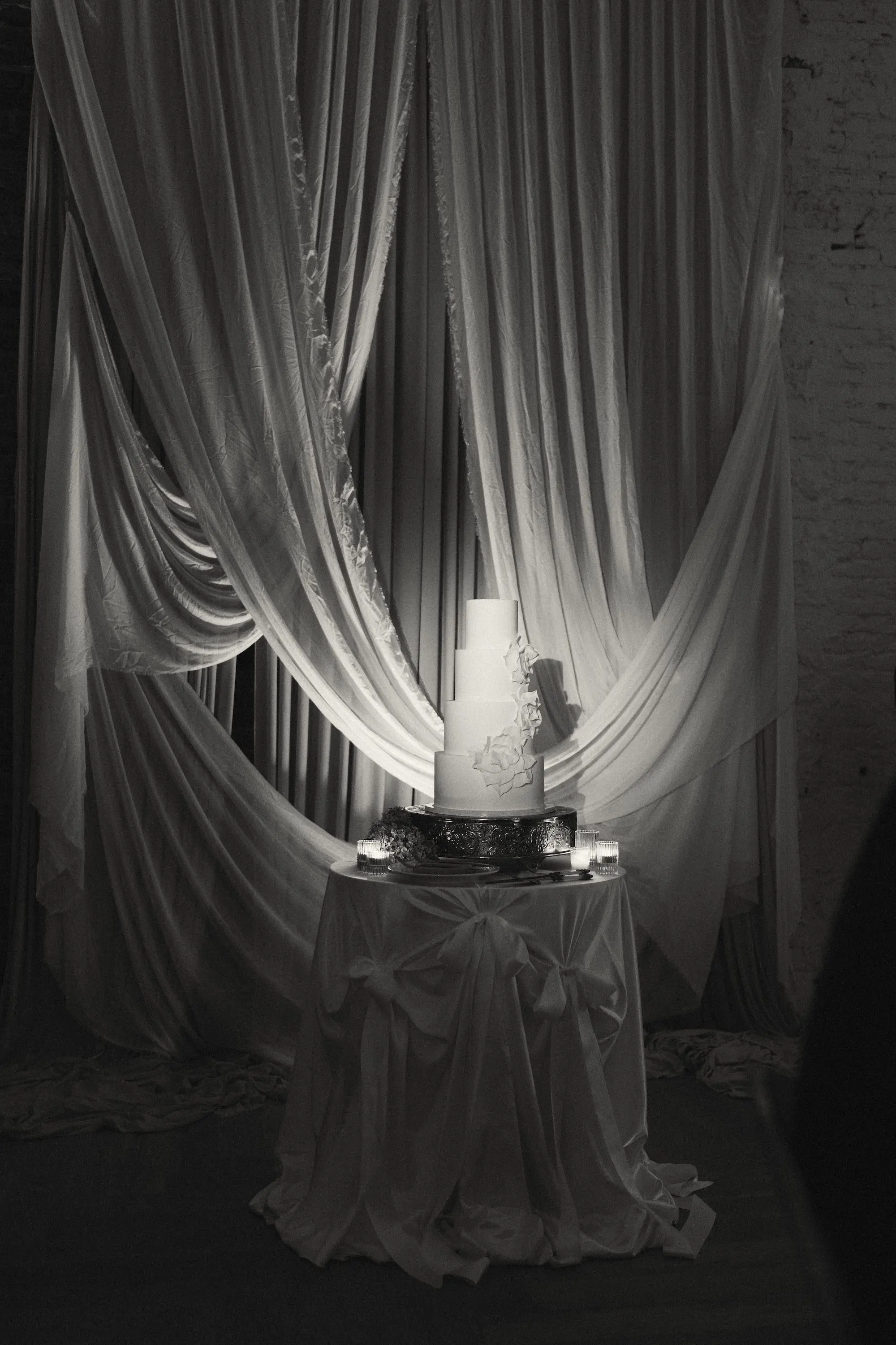 Black and White Wedding Portrait of Four Tier Wedding Cake with White Florals Inspiration | Tampa Bay Planner EventFull Weddings