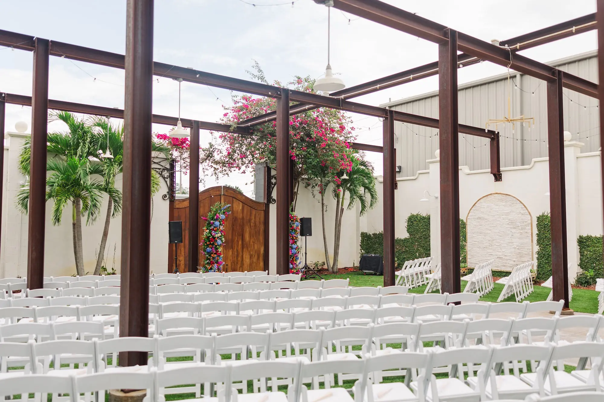 6Vibrant Blue Mexican Wedding Ideas Central Florida Venue 650 - Blue Mexican-Inspired Winter Haven Wedding | Venue 650 Bright Mexican Blue Fall Florida Outdoor Wedding Ceremony Inspiration | White Ceremony Chairs Ideas | Vibrant Red, Blue and Green Floral Ceremony Altar Decor Arrangements Inspiration | Chair Rentals A Chair Affair | Industrial Garden Wedding Venue Venue 650