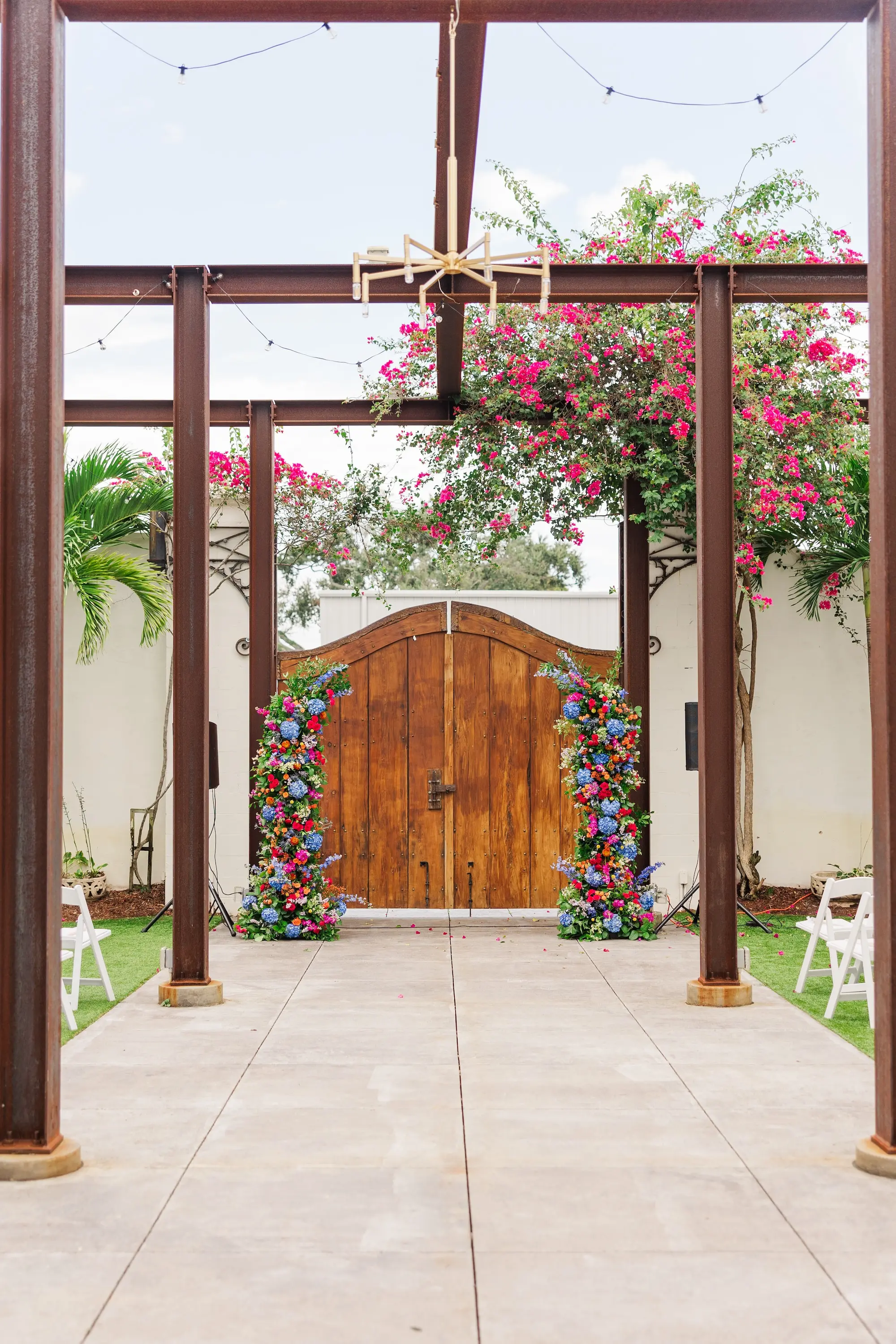 7Vibrant Blue Mexican Wedding Ideas Central Florida Venue 650 - Blue Mexican-Inspired Winter Haven Wedding | Venue 650 Bright Mexican Blue Fall Florida Outdoor Wedding Ceremony Inspiration | White Ceremony Chairs Ideas | Vibrant Red, Blue and Green Floral Ceremony Altar Decor Arrangements Inspiration | Chair Rentals A Chair Affair | Industrial Garden Wedding Venue Venue 650