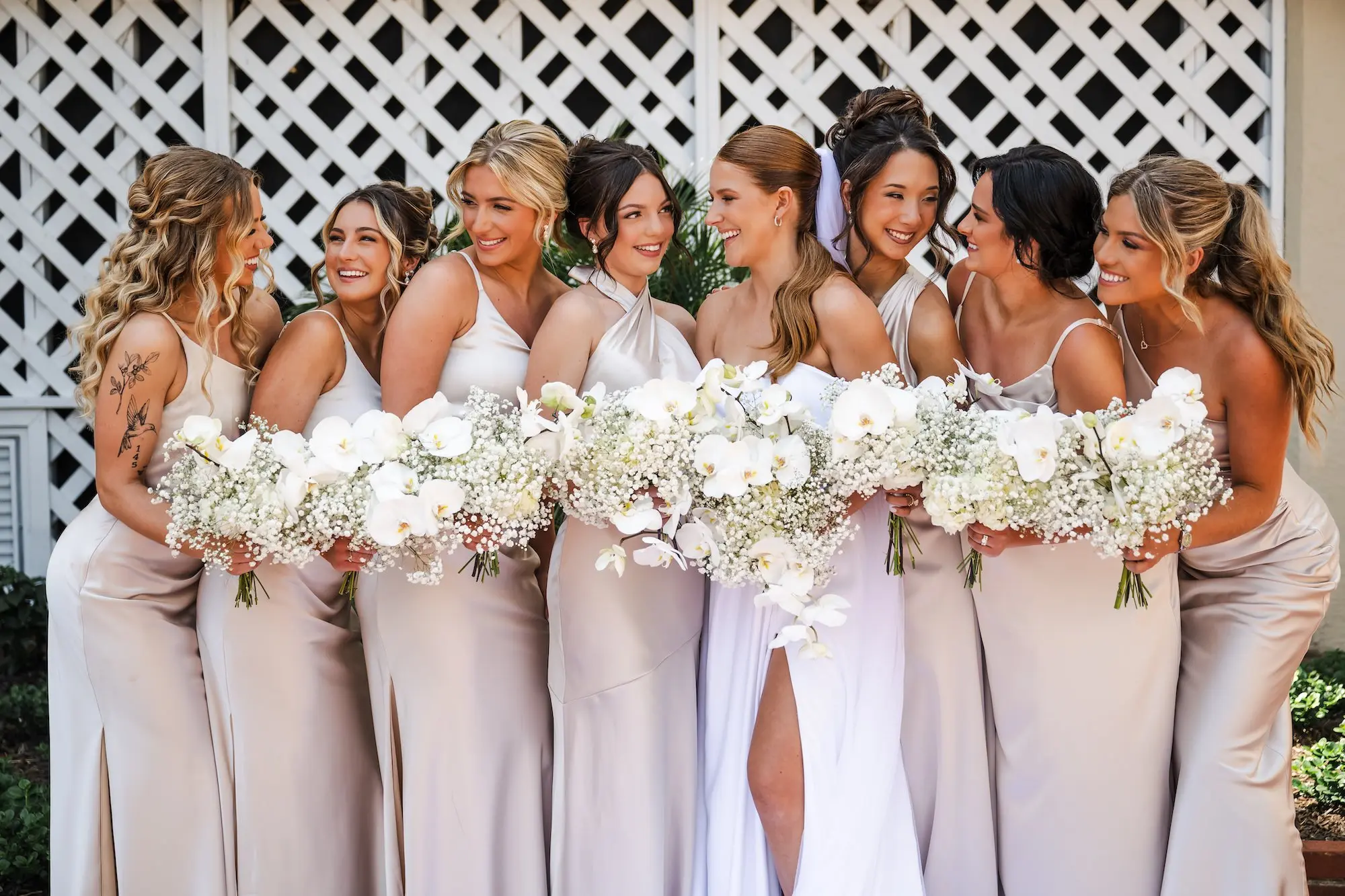 Bride with Bridesmaid Wedding Portrait | Different Style Satin Champagne Bridesmaids Inspiration | White Florals and Baby's Breath Bridal Bouquet Ideas
