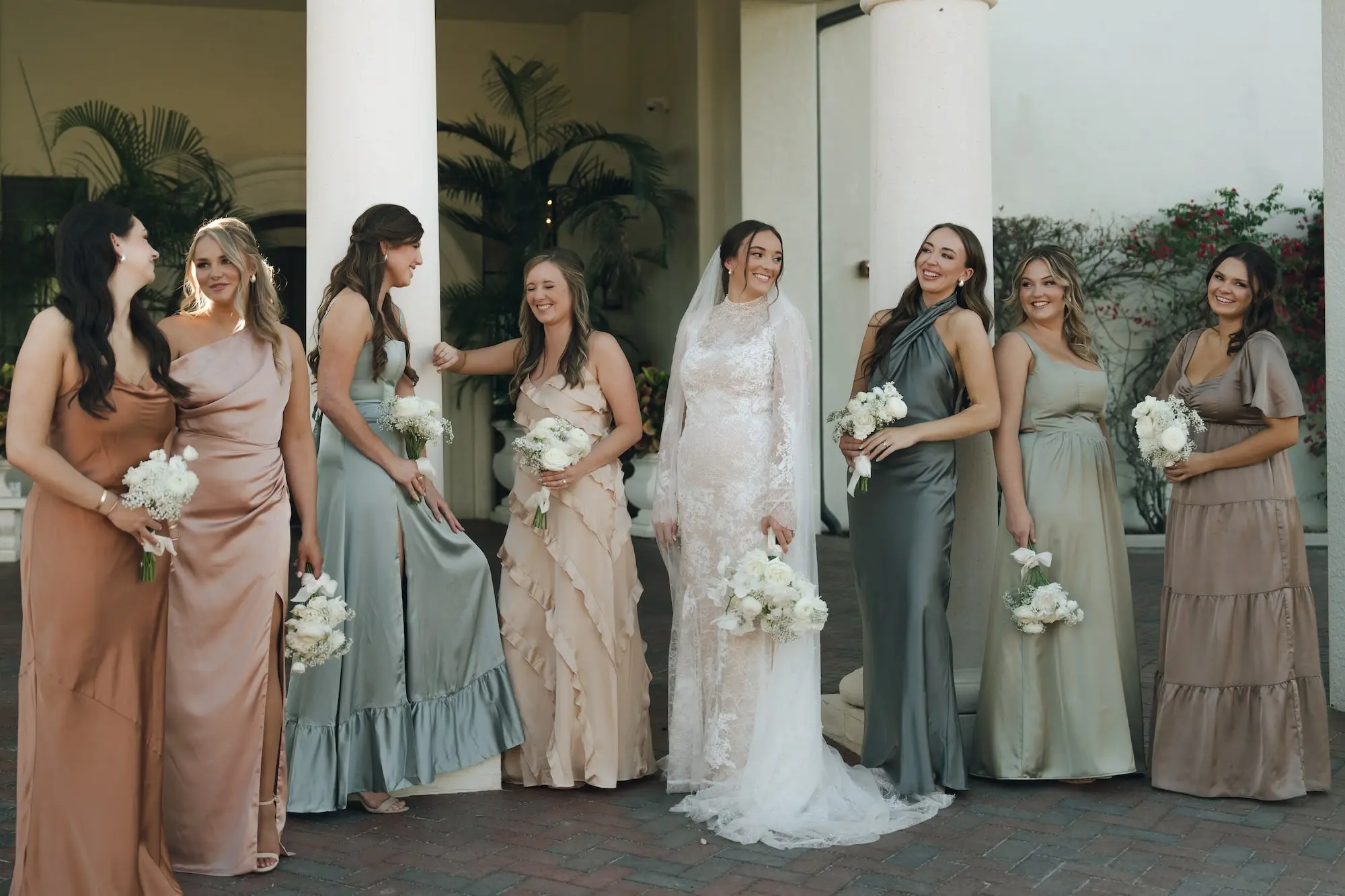 Bride and Bridesmaids Wedding Portrait | Rust, Green, and Pink Mismatched Satin Bridesmaids Dress Inspiration