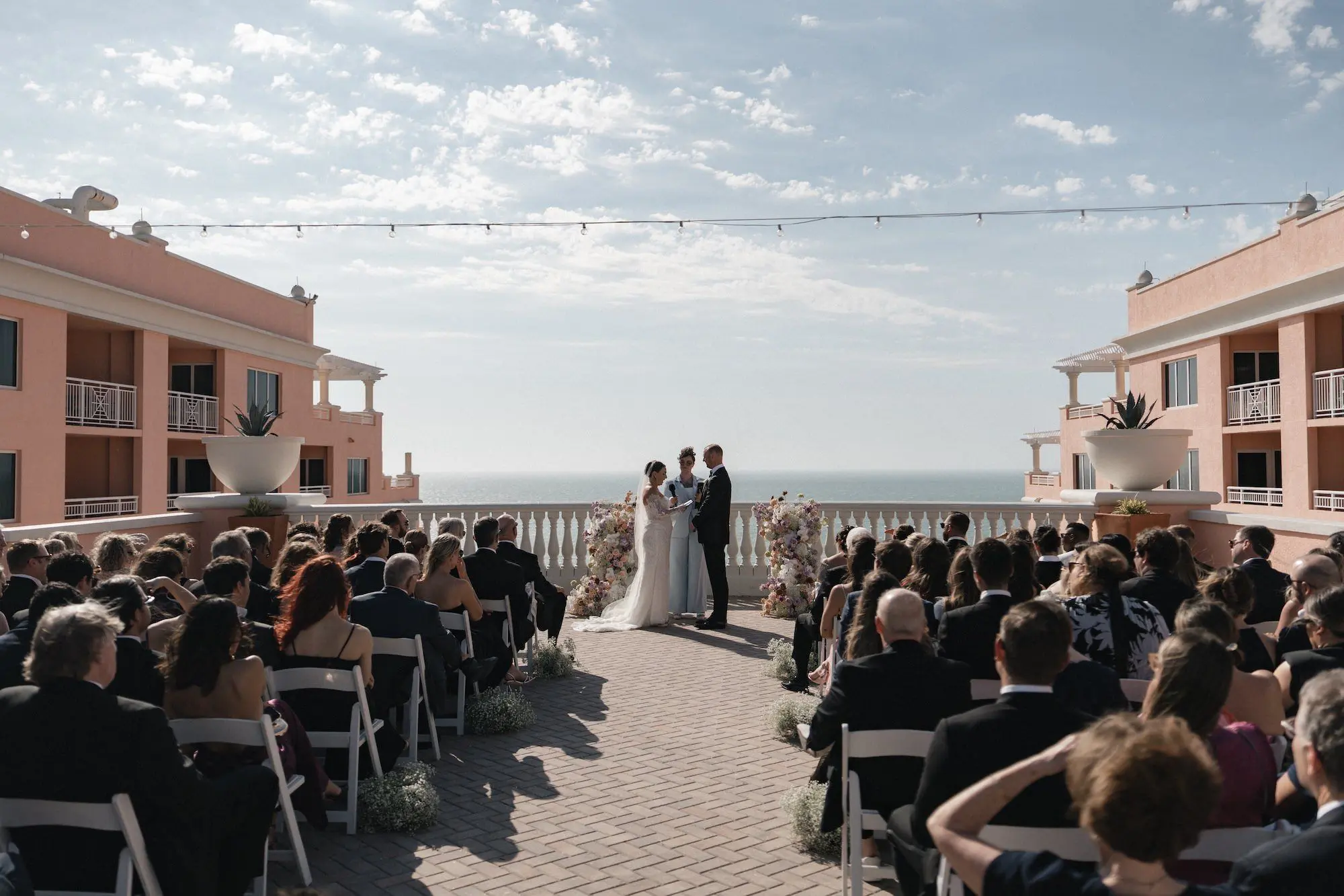 22Modern Disco Themed Florida Wedding Inspiration Venue Hyatt Regency Clearwater Beach - Romantic Disco-Themed Florida Wedding | Hyatt Regency Clearwater Beach Bride and Groom Outdoor Balcony Wedding Ceremony Vow Exchange Wedding
