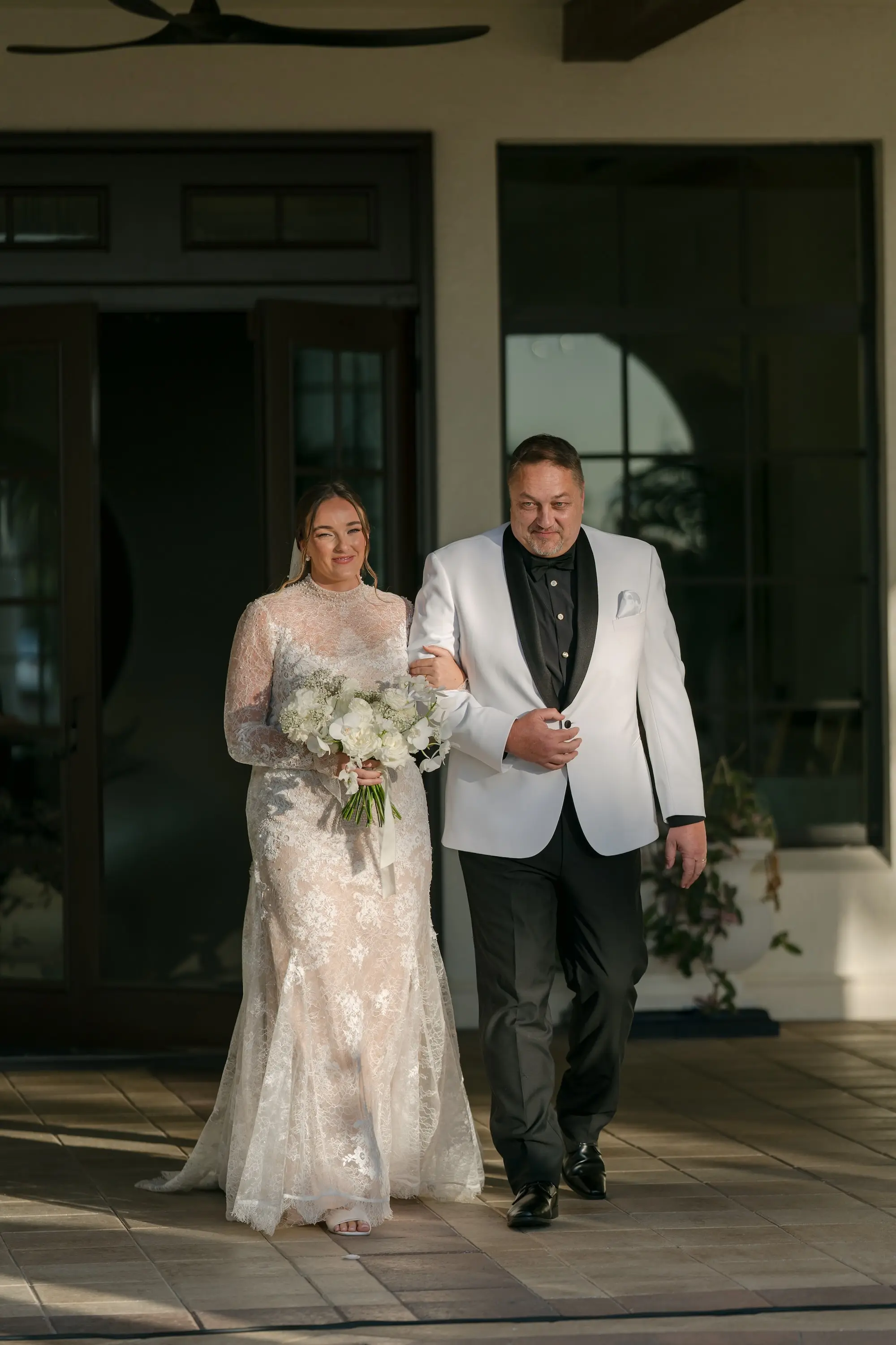 Bride and Father Walking Down Wedding Aisle Wedding Portrait | Father in White and Black Tuxedo Ideas