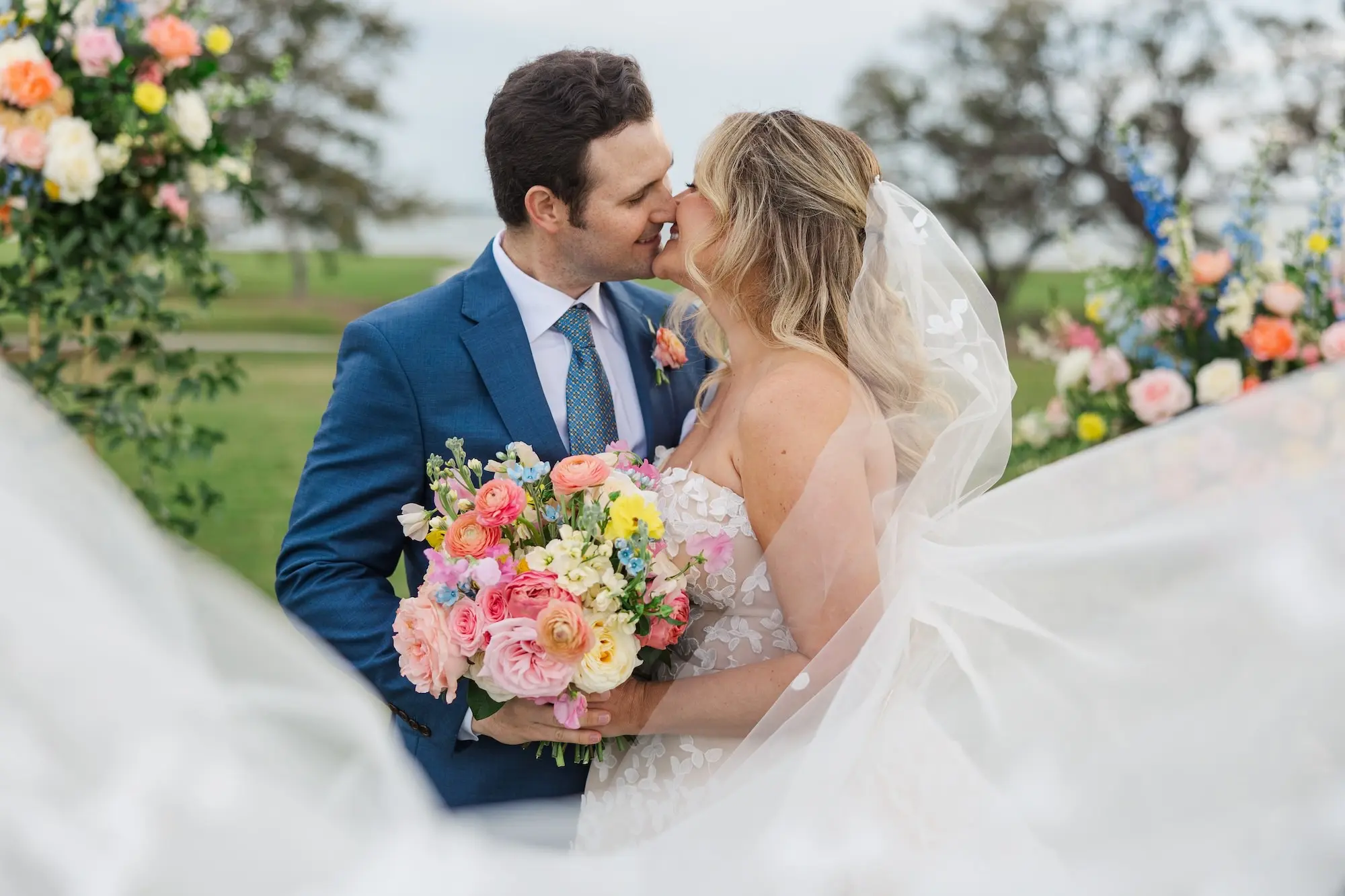 Bride and Groom Wedding Portrait | Outdoor Spring Garden Party Wedding Ceremony Aisle and Altar Decor Ideas | Pink, Blue, Yellow, White, and Orange Flower Arrangement Inspiration | Bridgerton Garden Wedding Inspiration | Tampa Bay Florist Bruce Wayne Florals | Photographer Mary Anna Photography