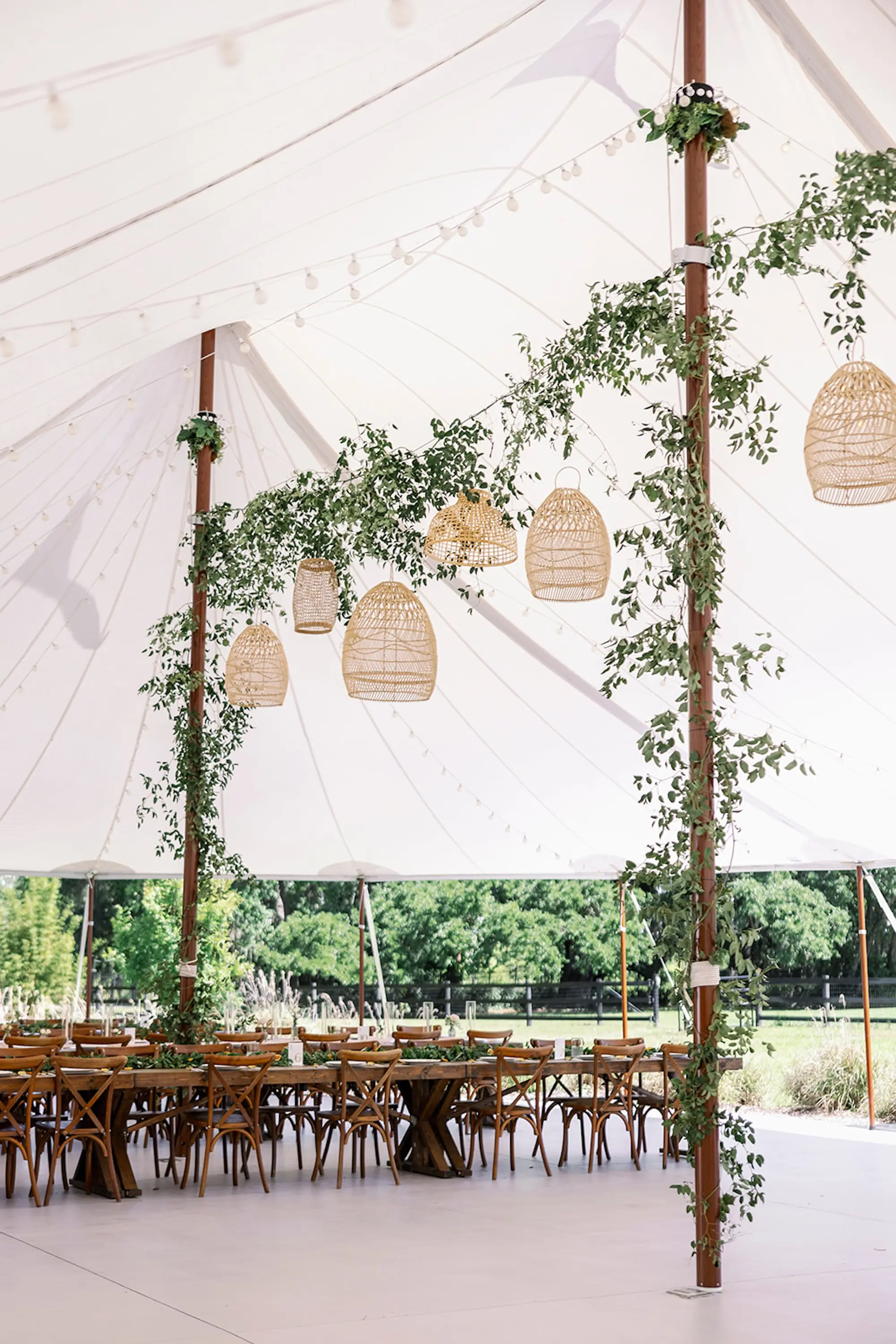 Estate Green Outdoor Tented Wedding Reception Inspiration | Woven Baskets and Eucalyptus Garland Wedding Reception Decor Ideas | Long Wooden Wedding Reception Tables Inspiration | Tampa Bay Venue Mill Pond Estate | Tampa Bay Planner Wilder Mind Events