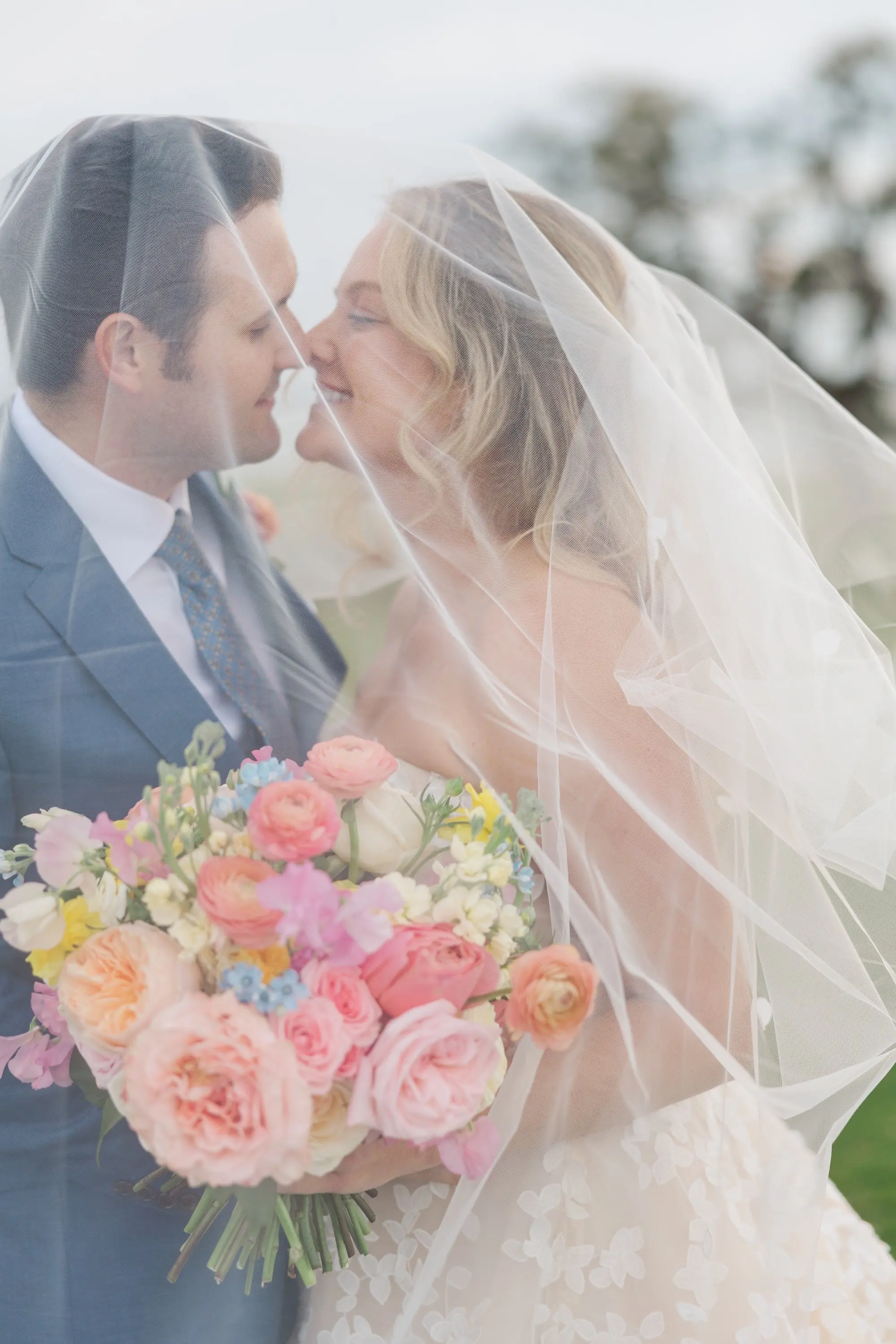 Bride and Groom in Cathedral Length Traditional Veil Wedding Portrait | Pink, Blue, Yellow, White, and Orange Bridal Bouquet Inspiration | Bridgerton Garden Wedding Inspiration | Tampa Bay Florist Bruce Wayne Florals | Photographer Mary Anna Photography