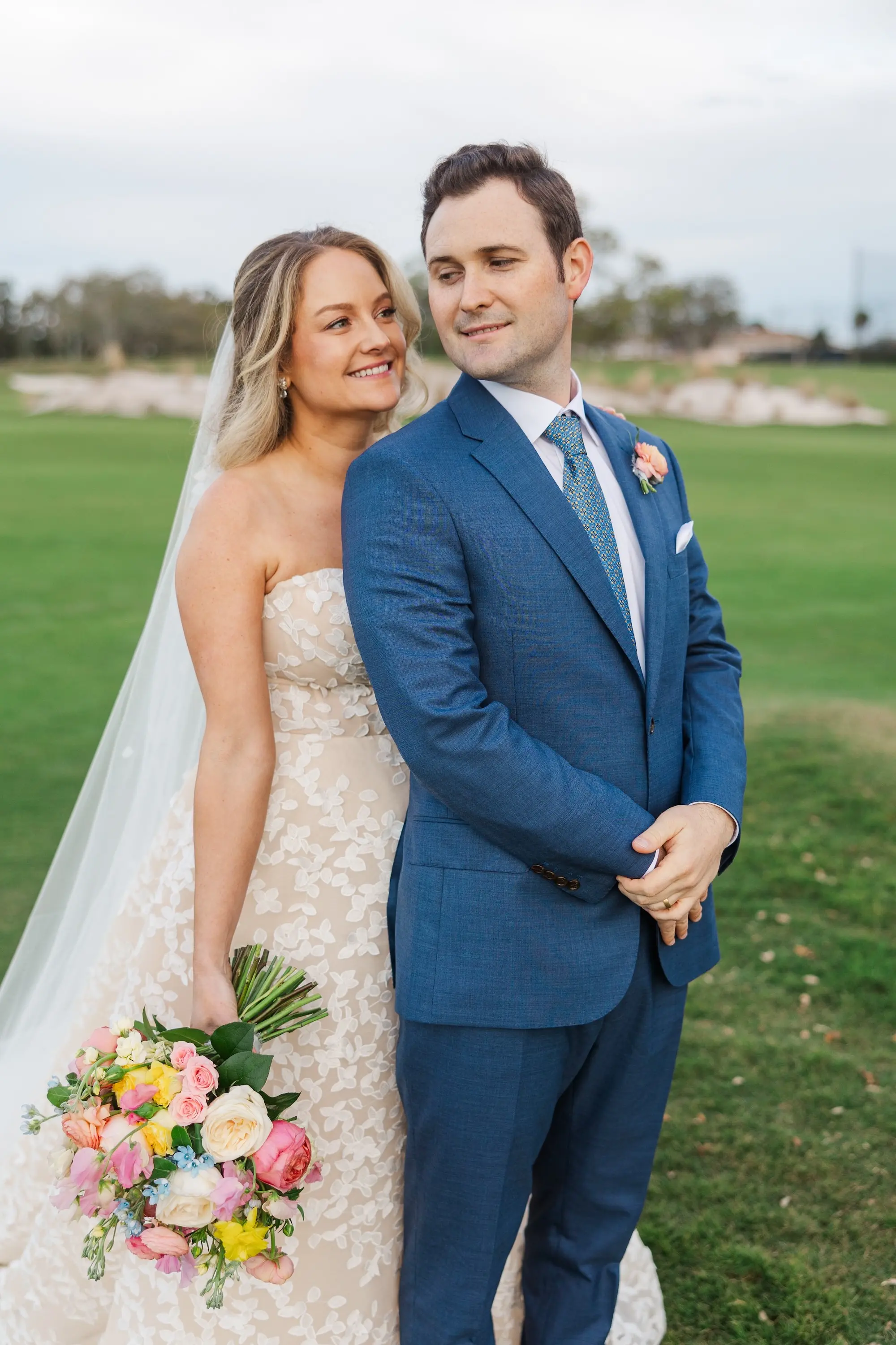 Bride and Groom Wedding Portrait | Pastel Pink, Blue, Yellow, White, and Orange Bridal Bouquet Inspiration | Bridgerton Garden Wedding Inspiration | Soft Romantic Half Up Half Down Curls Bridal Wedding Hair Ideas | Blush Lip and Natural Beauty Makeup Inspiration | Clearwater Photographer Mary Anna Photography | Florist Bruce Wayne Florals | Tampa Bay Hair and Makeup Artist Femme Akoi Beauty Studio