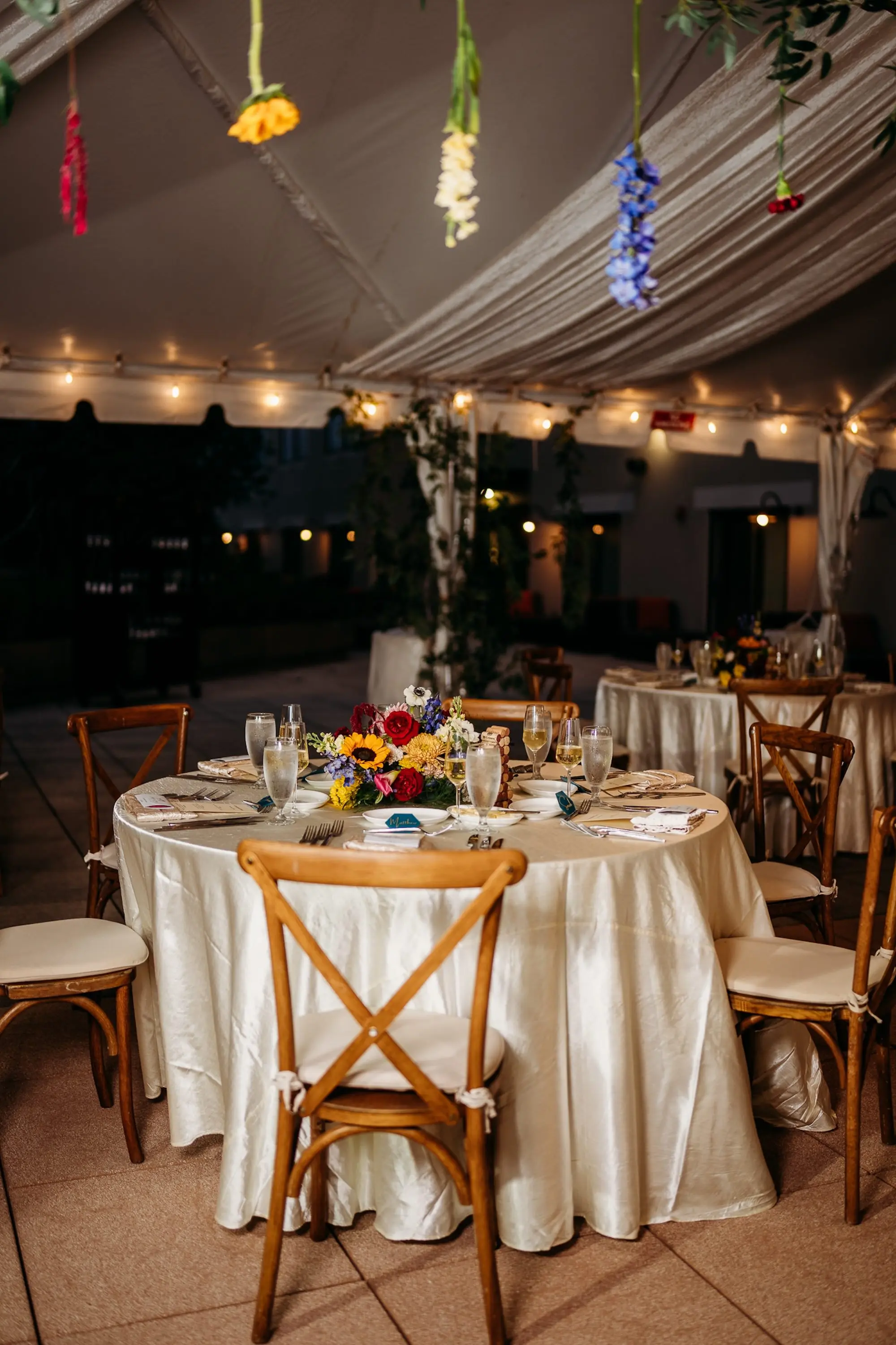Colorful Floral Filled Wedding Reception Centerpiece Decor Ideas | Red, Yellow, Blue, and White Florals